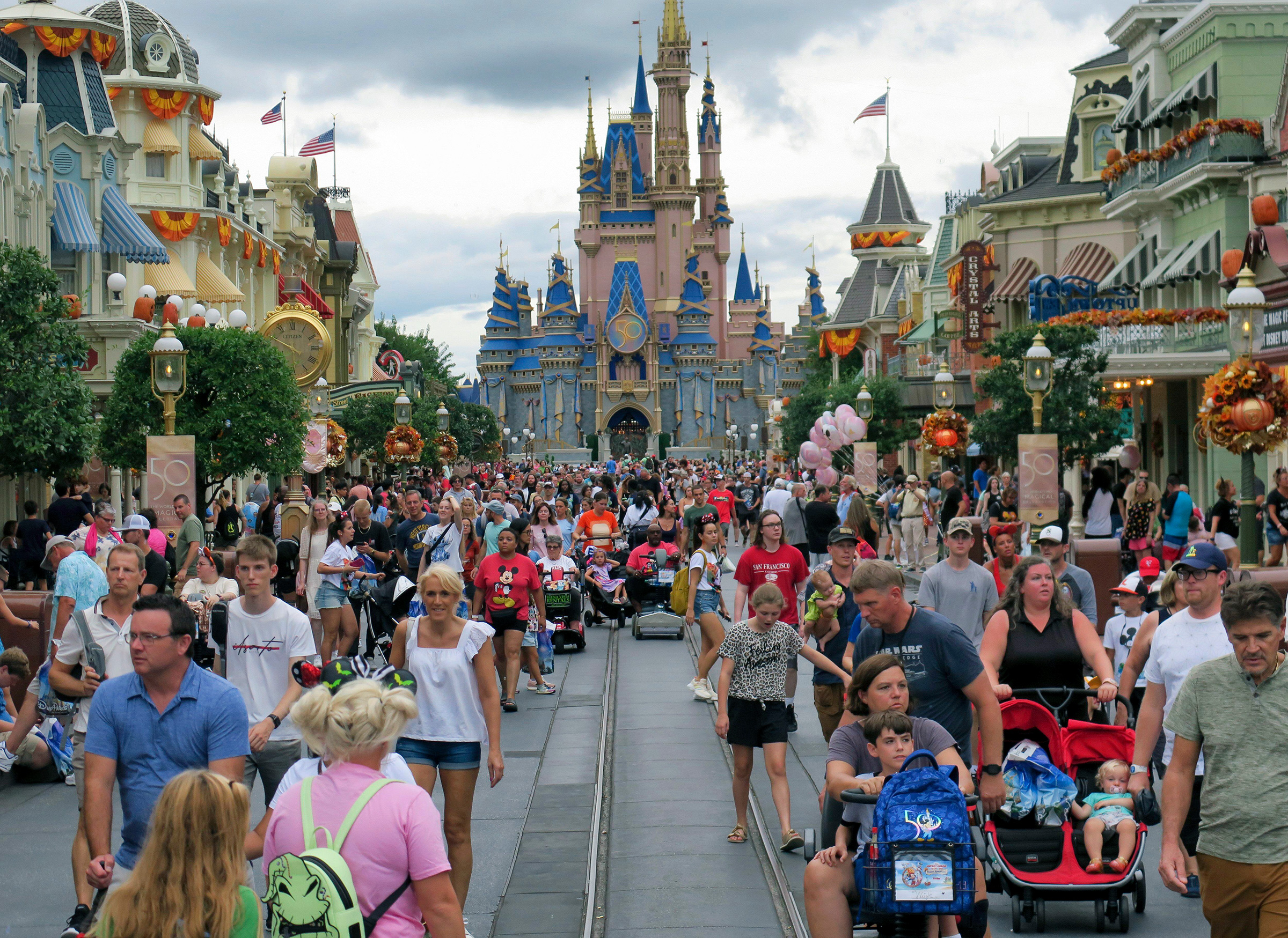 People visit the Magic Kingdom at Walt Disney World on Sept. 27, 2022, in Lake Buena Vista, Fla. 