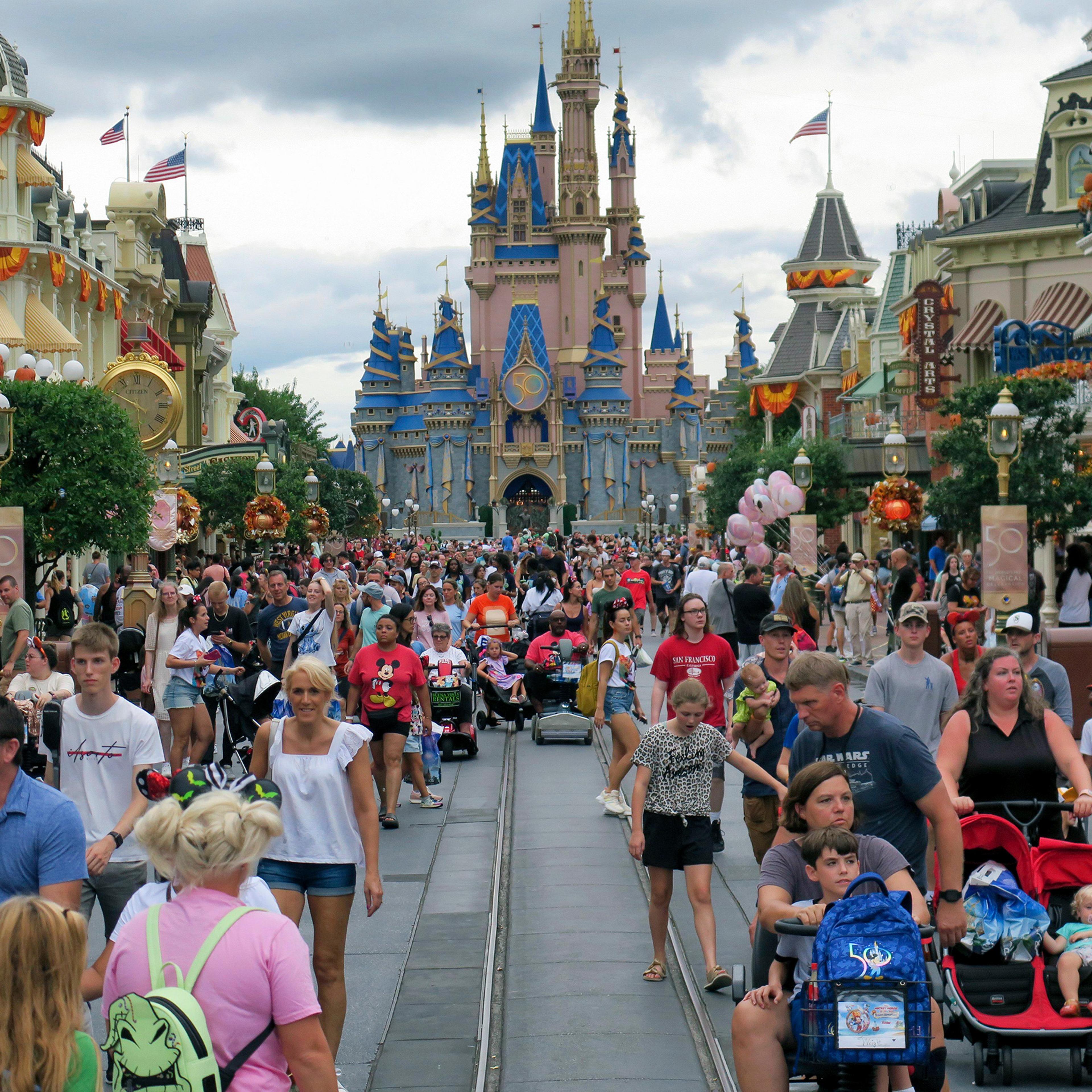 People visit the Magic Kingdom at Walt Disney World on Sept. 27, 2022, in Lake Buena Vista, Fla.