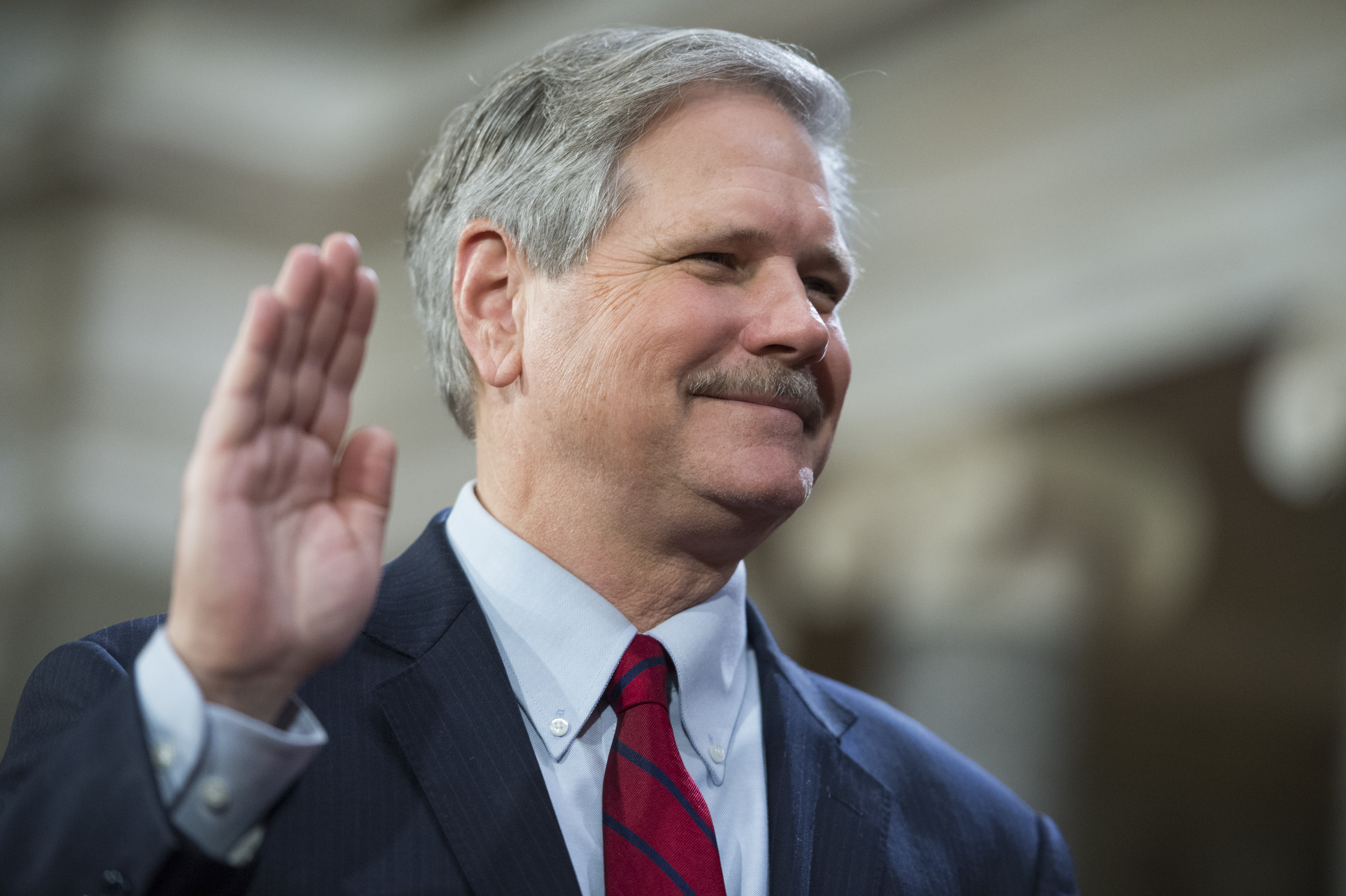 Sen. John Hoeven, R-N.D., is administered an oath by Vice President Joe Biden during a swearing-in ceremony in the Capitol's Old Senate Chamber, January 03, 2016.