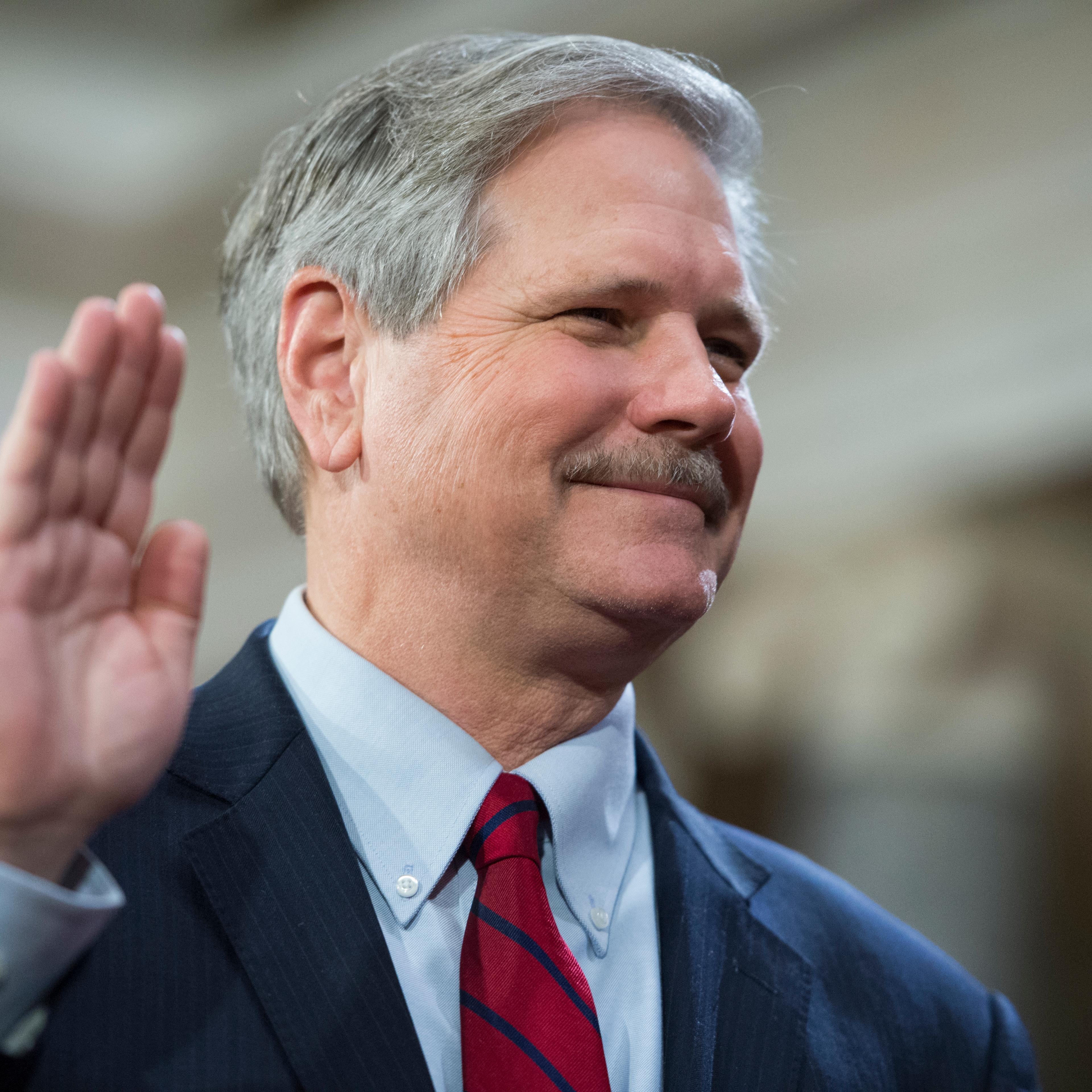 Sen. John Hoeven, R-N.D., is administered an oath by Vice President Joe Biden during a swearing-in ceremony in the Capitol's Old Senate Chamber, January 03, 2016.