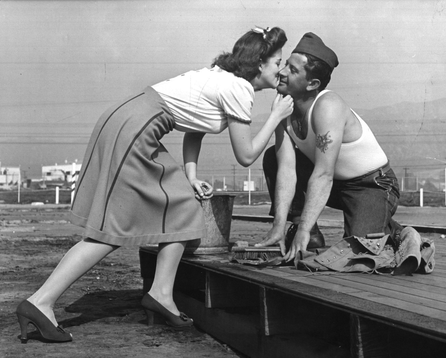 <strong>Caption from LIFE.</strong> "A tent-floor scrubber sticks his neck out and recieves a right and a lip to the jaw. 'Now I won't mind if I kick the bucket,' cried he as he rose and upset his scrub pail."