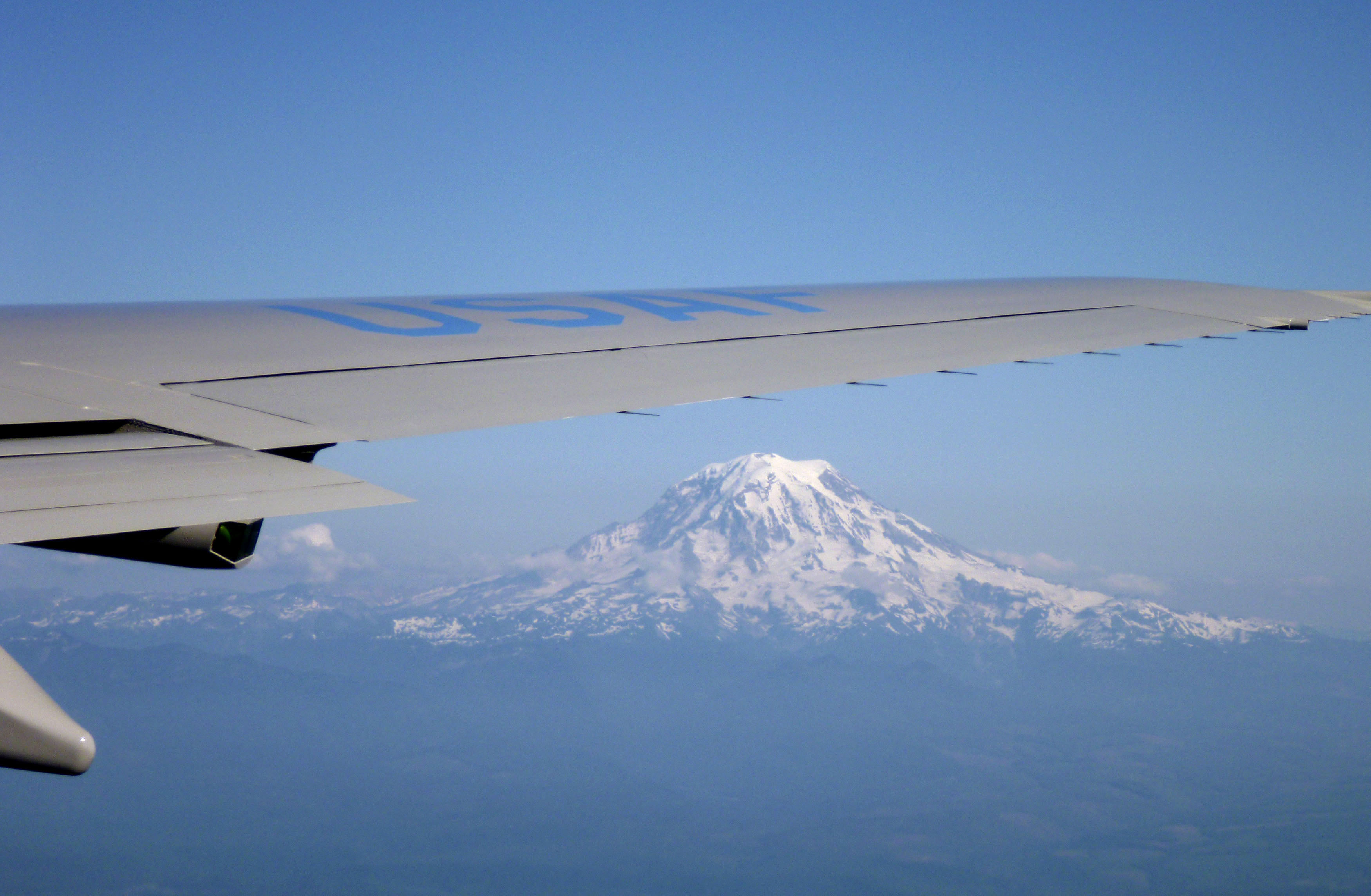 Mount Rainier is seen under the right wing of Air Force One while heading towards Seattle