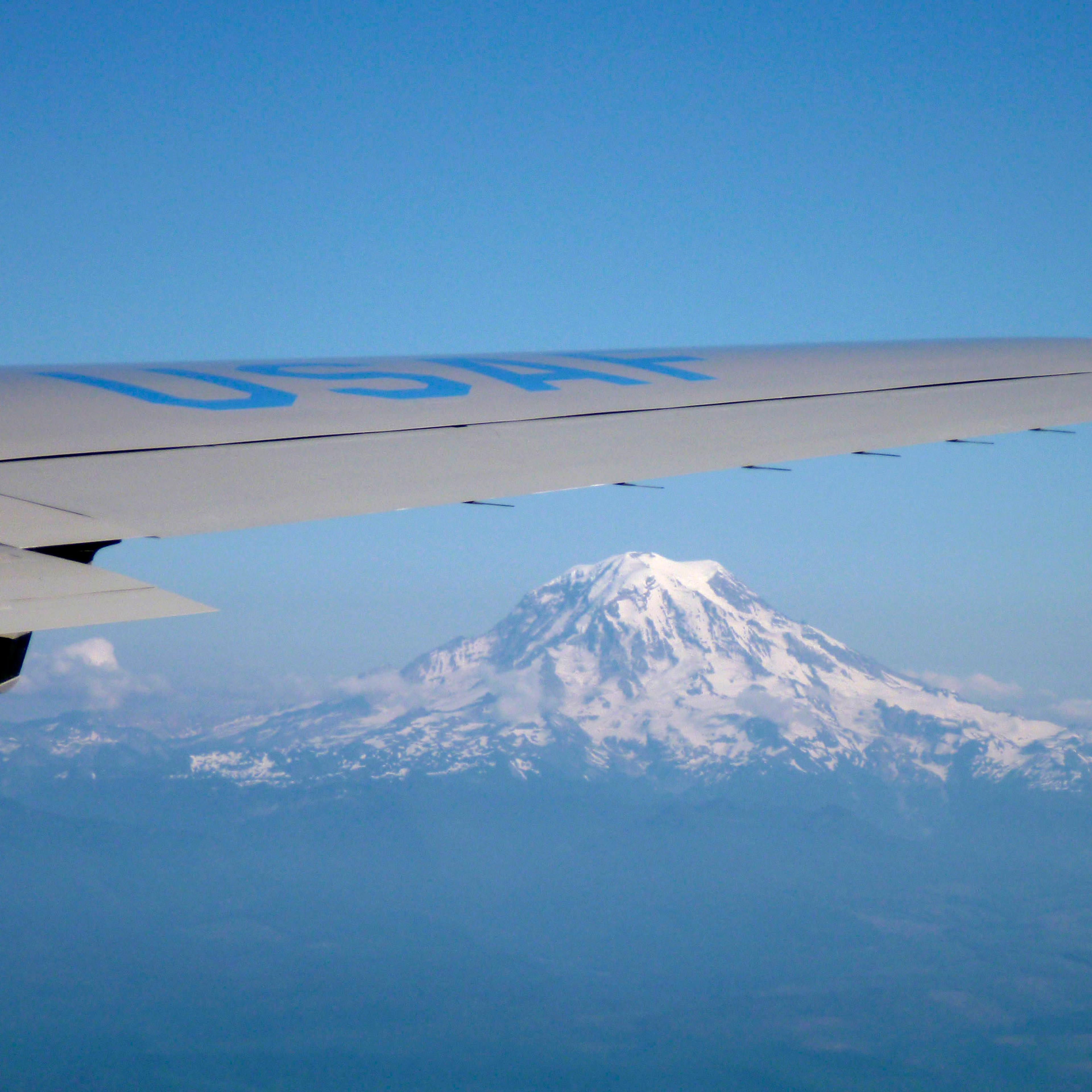 Mount Rainier is seen under the right wing of Air Force One while heading towards Seattle