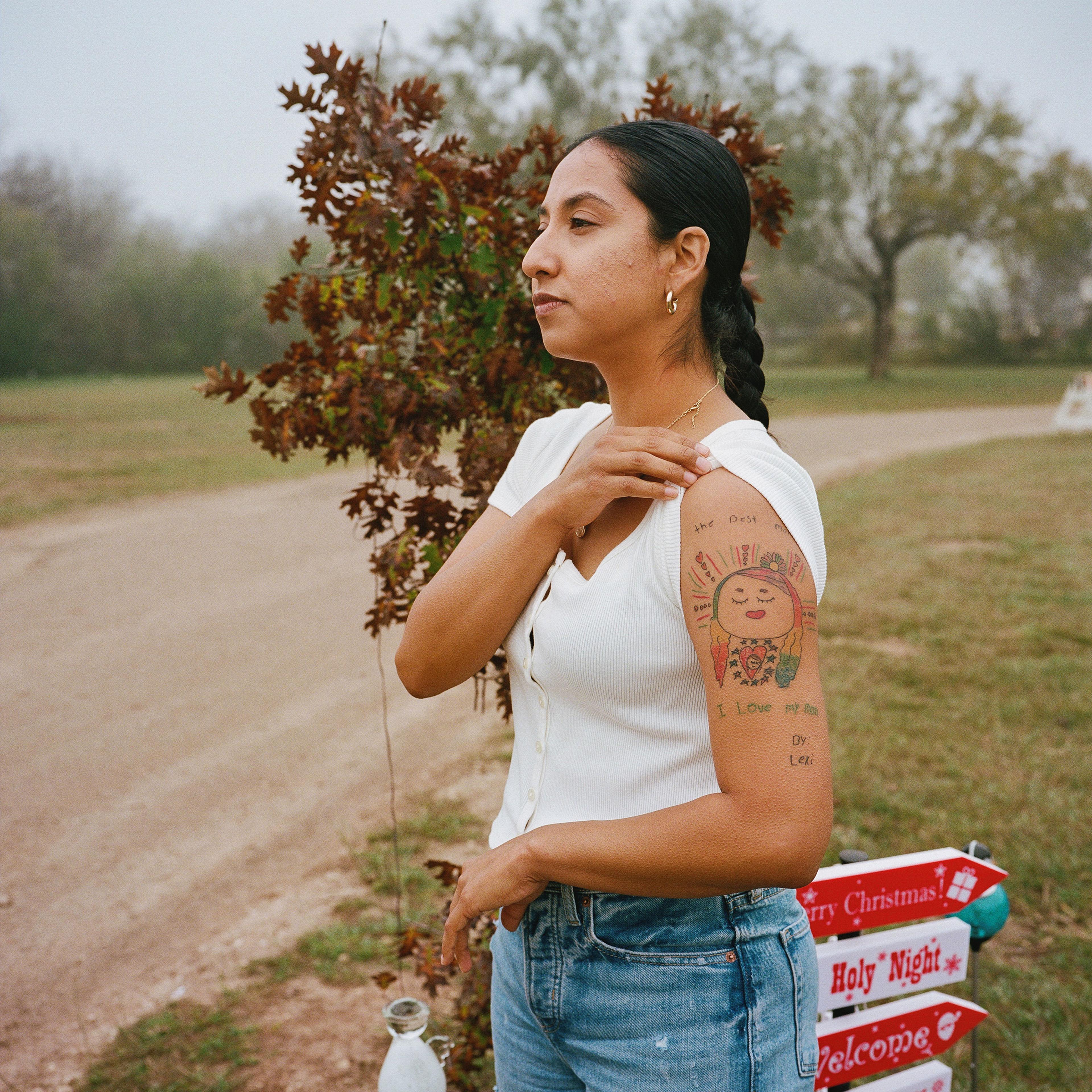 Uvalde, Texas - December 12, 2022:Kimberly, the mother of Lexi Rubio who was killed at the Robb Elementary School shooting earlier this year, presented the tattoo that she got in honor of her daughter while visiting the plot at the cemetery where Lexi’s