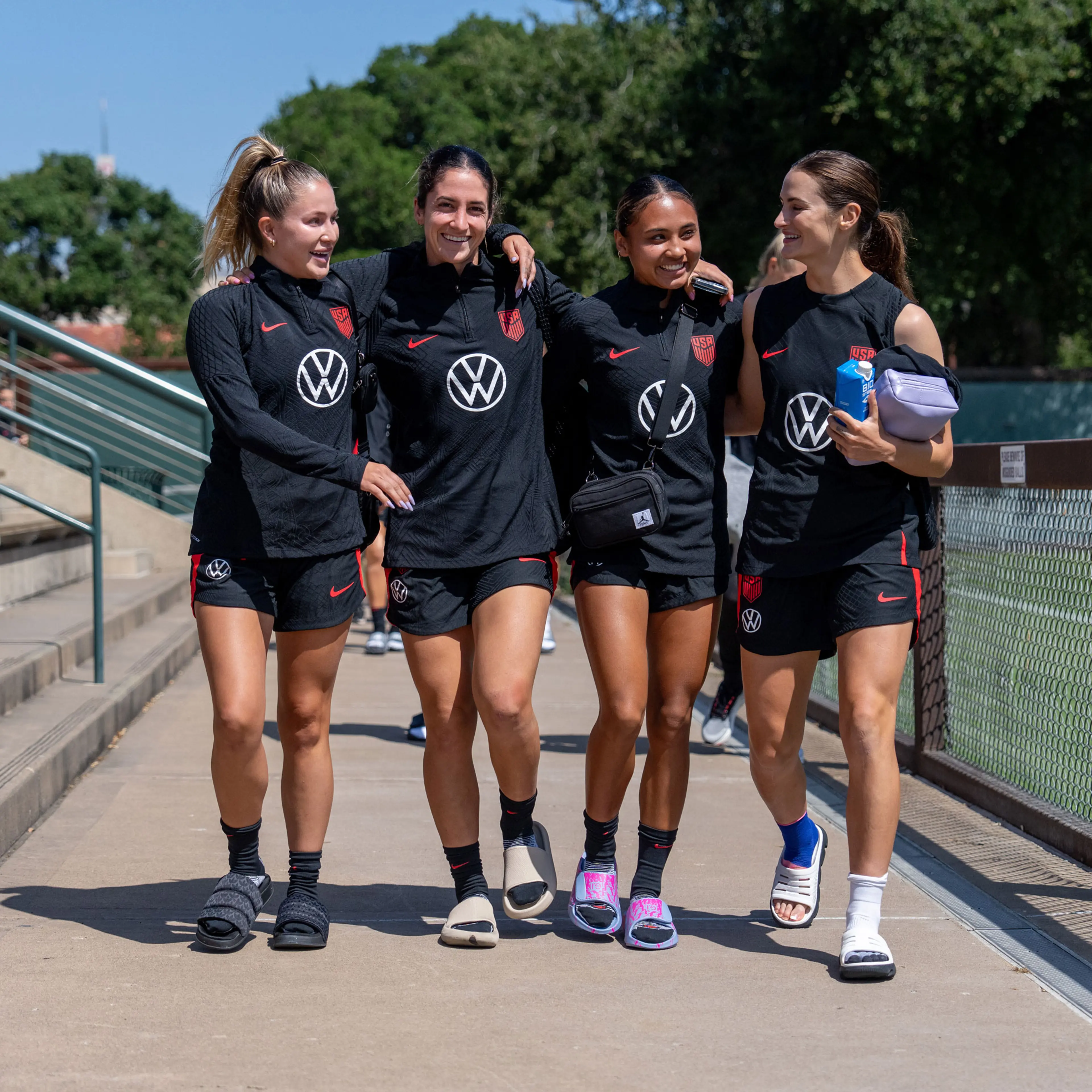 Ashley Sanchez, Savannah DeMelo, Alyssa Thompson, and Emily Fox arrive at the field during USWNT training