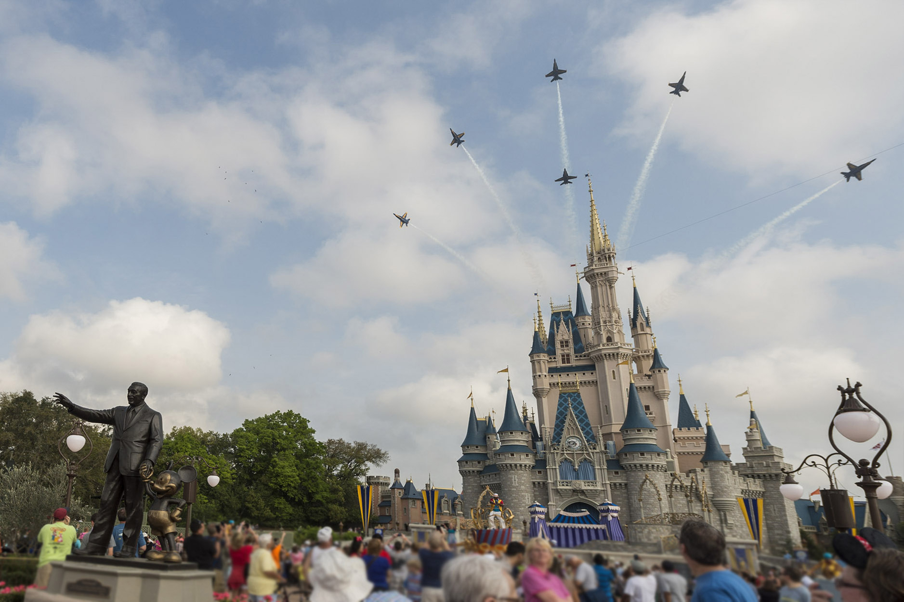 In this handout photo provided by Disney Parks, in a special moment for Magic Kingdom guests, the U.S. Navy Flight Demonstration Squadron, the Blue Angels, streaked across the skies above, Cinderella Castle Walt Disney World Resort in Lake Buena Vista, F