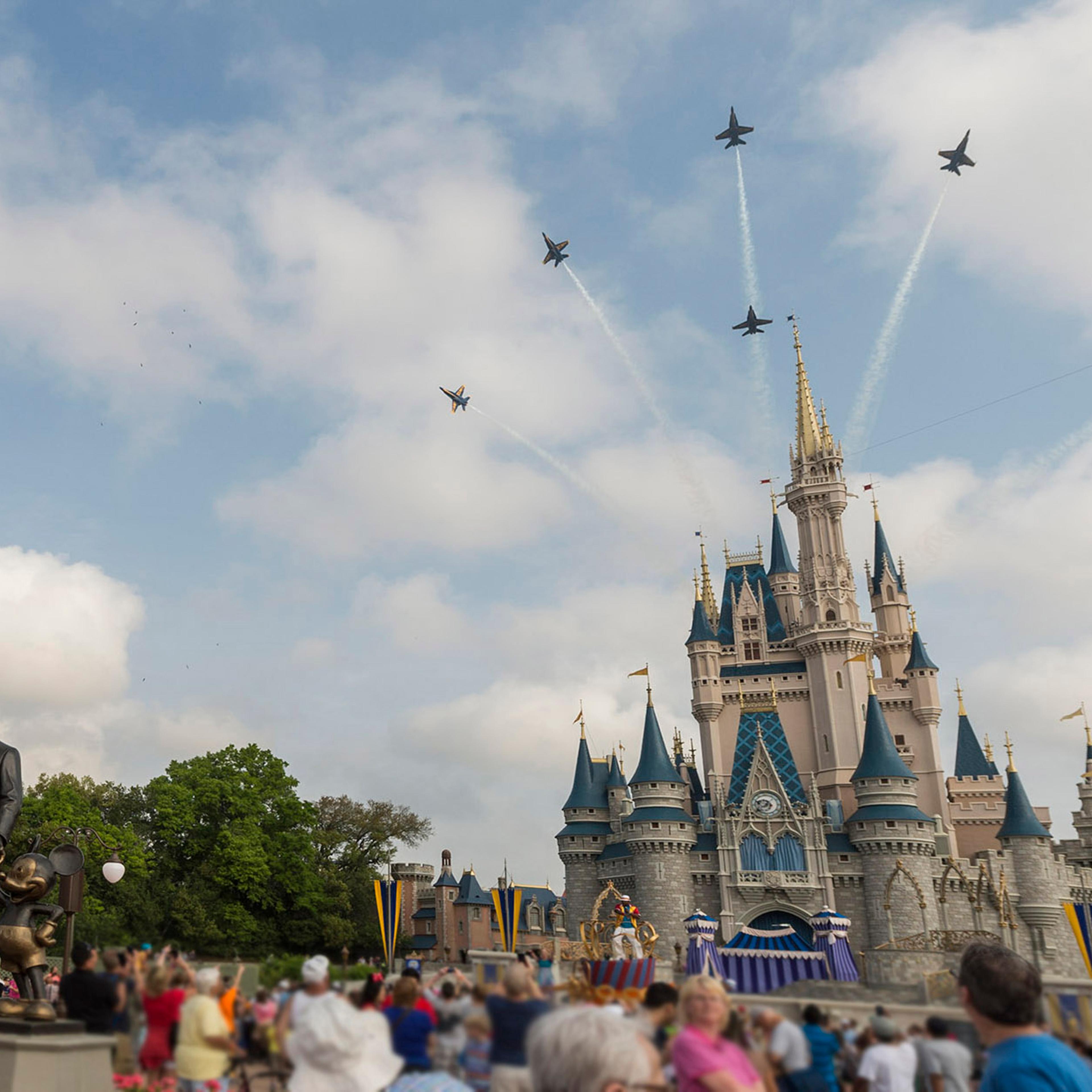 In this handout photo provided by Disney Parks, in a special moment for Magic Kingdom guests, the U.S. Navy Flight Demonstration Squadron, the Blue Angels, streaked across the skies above, Cinderella Castle Walt Disney World Resort in Lake Buena Vista, F
