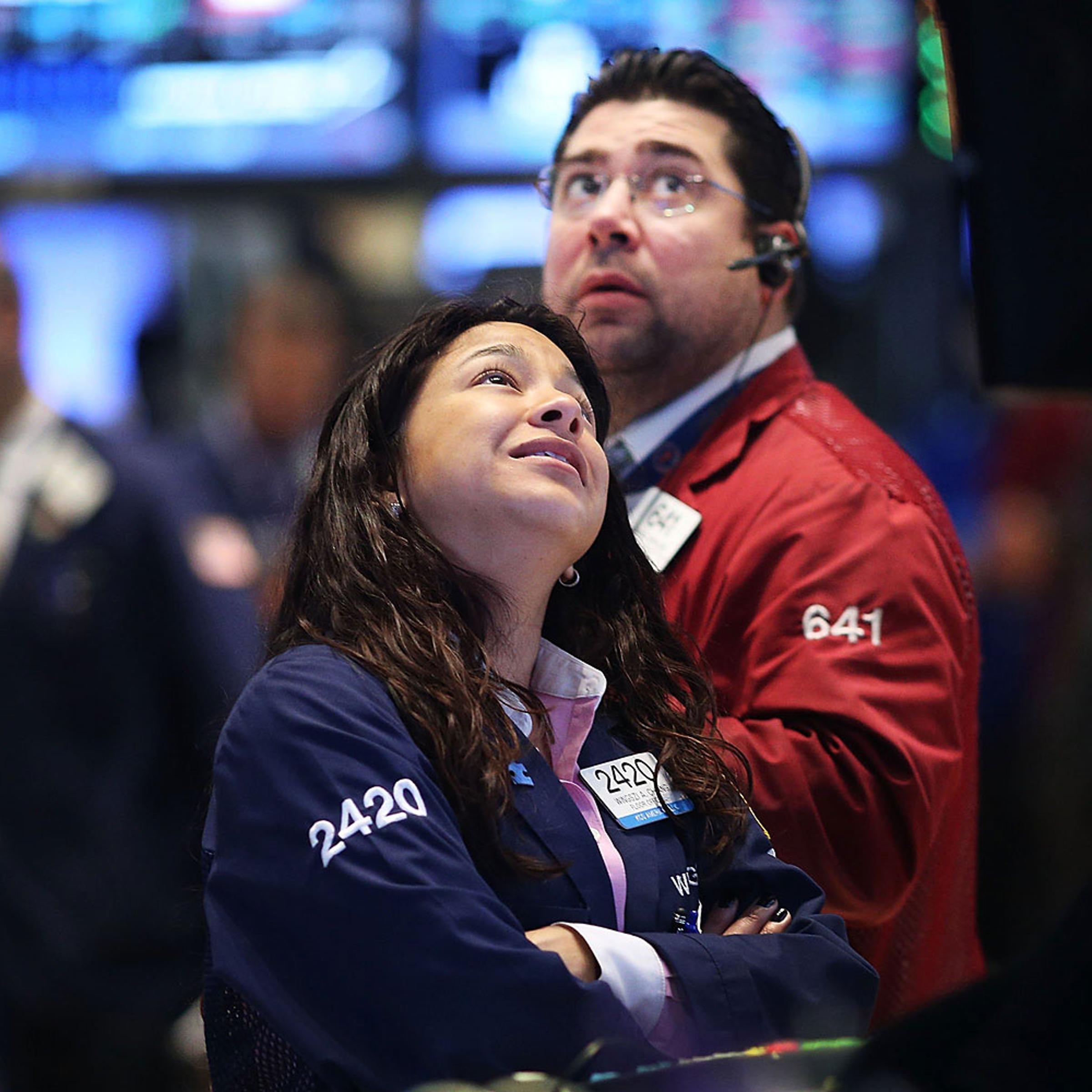 Traders work on the floor of the New York Stock Exchange in New York City.