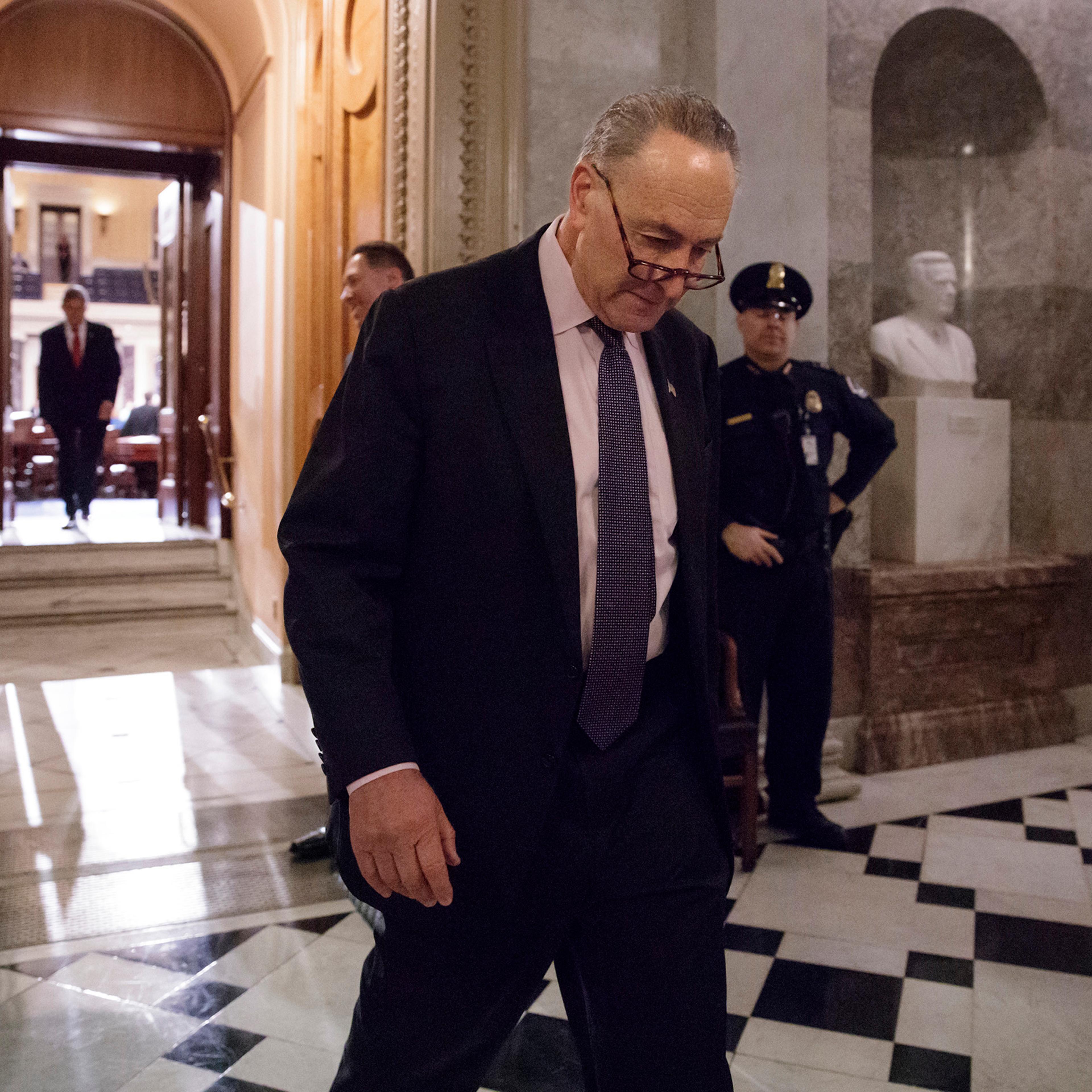 Senate Minority Leader Charles Schumer of N.Y. departs the Senate chamber, as lawmakers gathered for a predawn vote to advance the nomination of Education Secretary-designate Betsy DeVos, Washington, D.C., Feb. 3, 2017.
