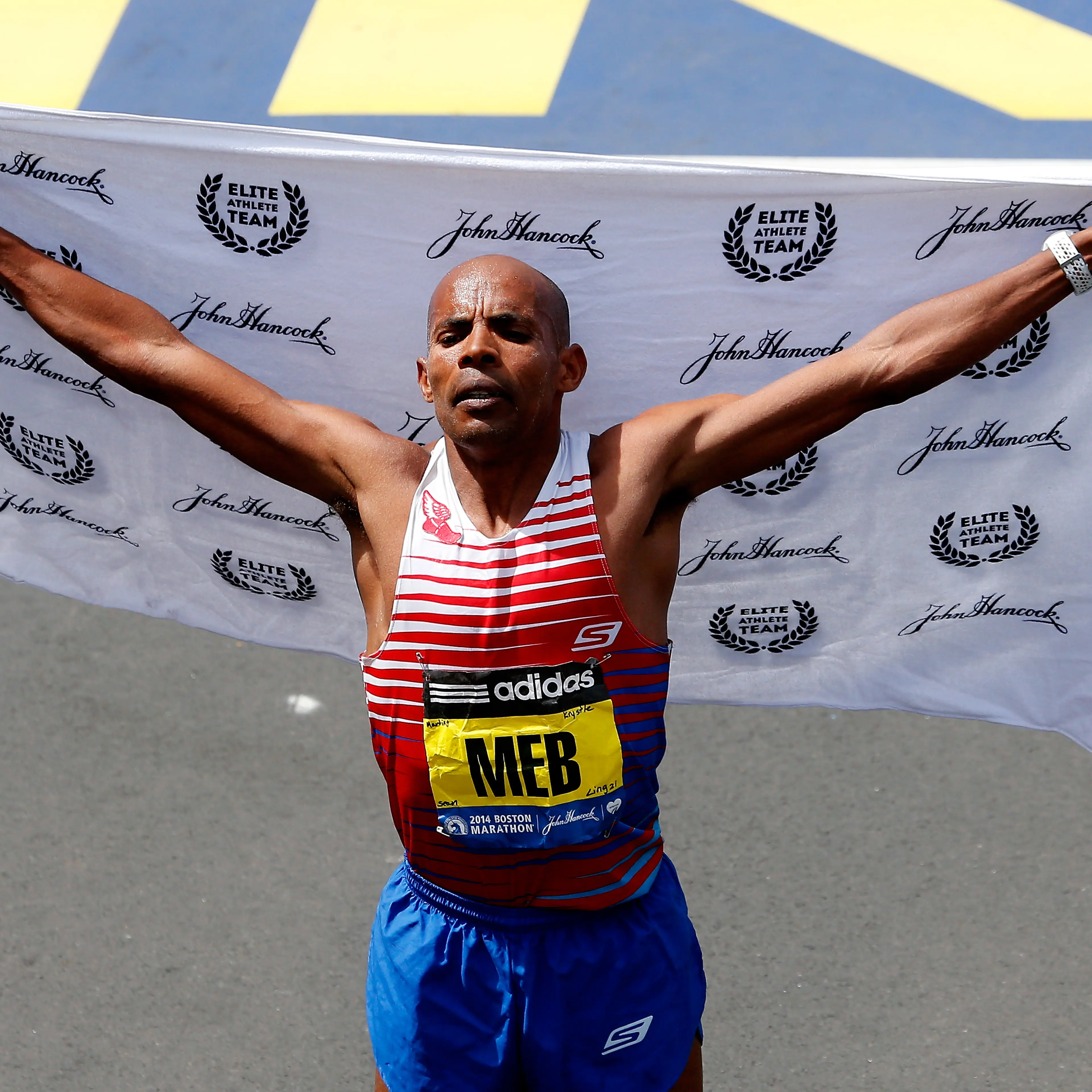 Meb Keflezighi crosses the finish line of the 118th Boston Marathon on April 21, 2014 in Boston, Massachusetts.
