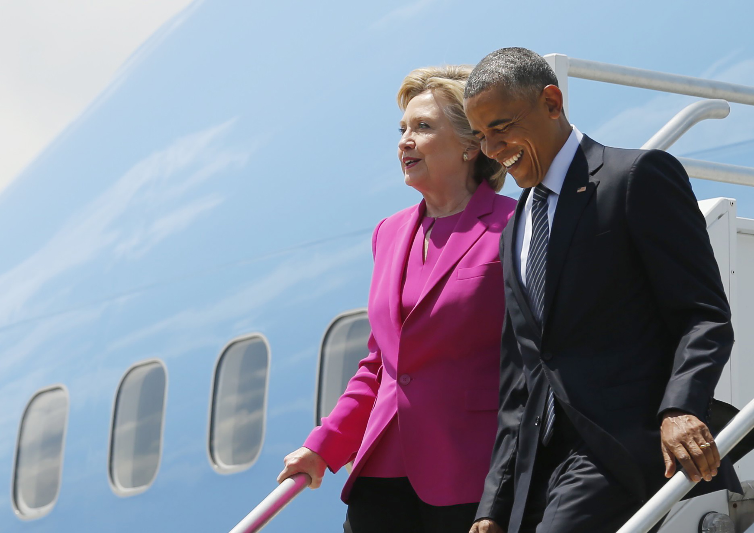Barack Obama and Hillary Clinton arrive prior to a campaign event in Charlotte, North Carolina, July 5, 2016.
