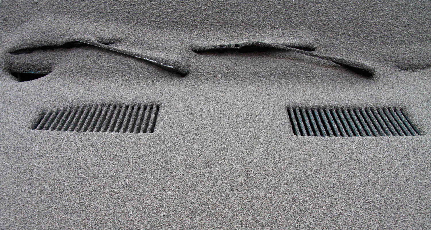 A car is completely covered in volcanic ash in San Carlos de Bariloche, southern Argentina, June 5, 2011.