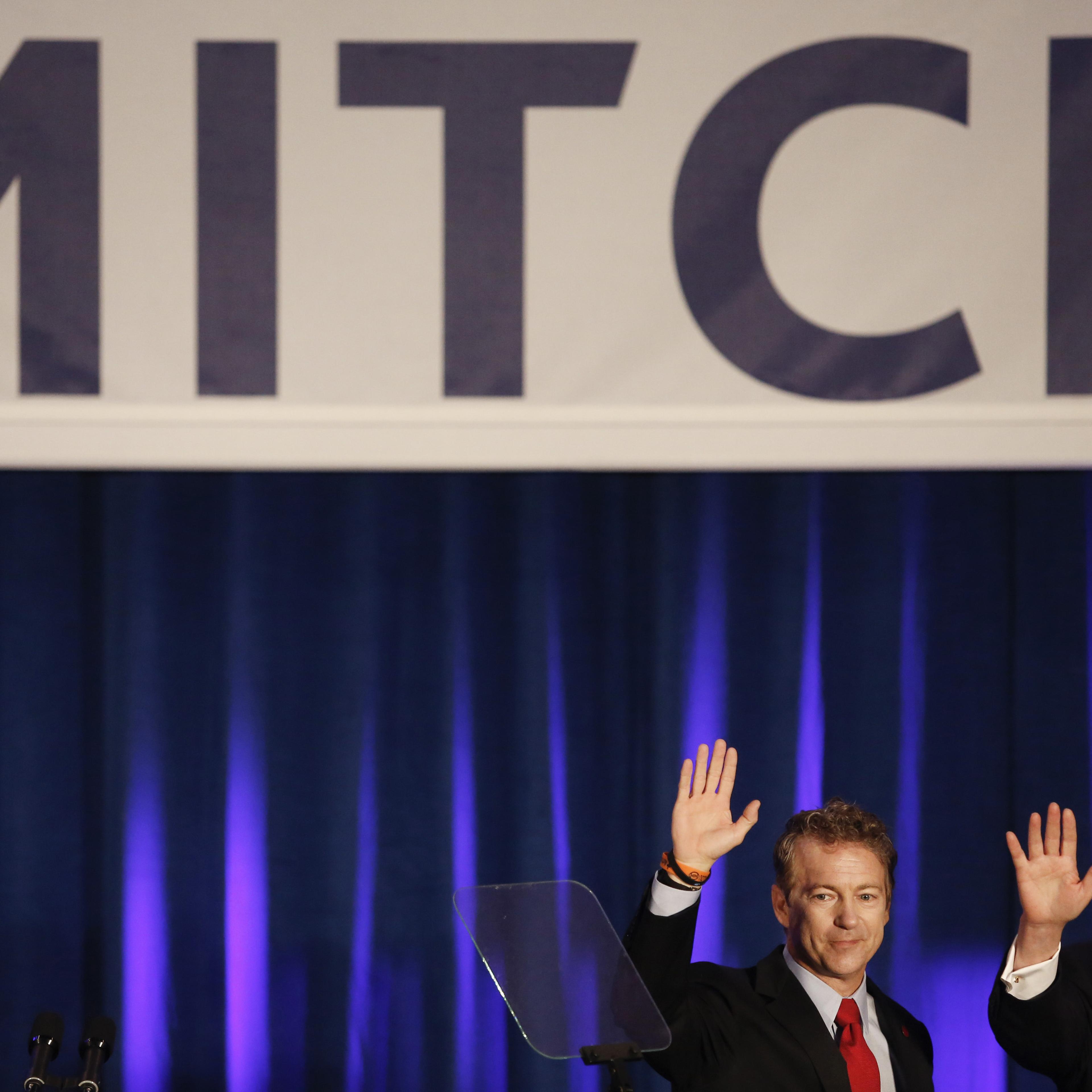 Senate Minority Leader Mitch McConnel and Senator Rand Paul wave to supporters at a Republican Party of Kentucky election night party in Louisville on Nov. 4, 2014.