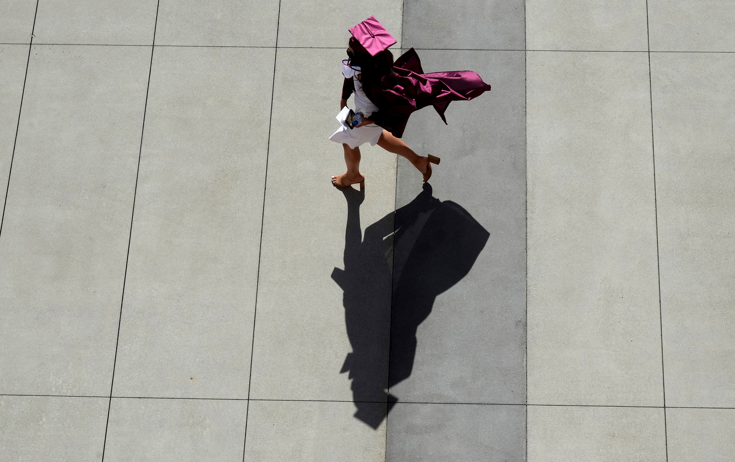 A graduate makes their way to the staging area during the 2021 Mt. Sac graduation in Walnut, Calif. on June 11, 2021. 