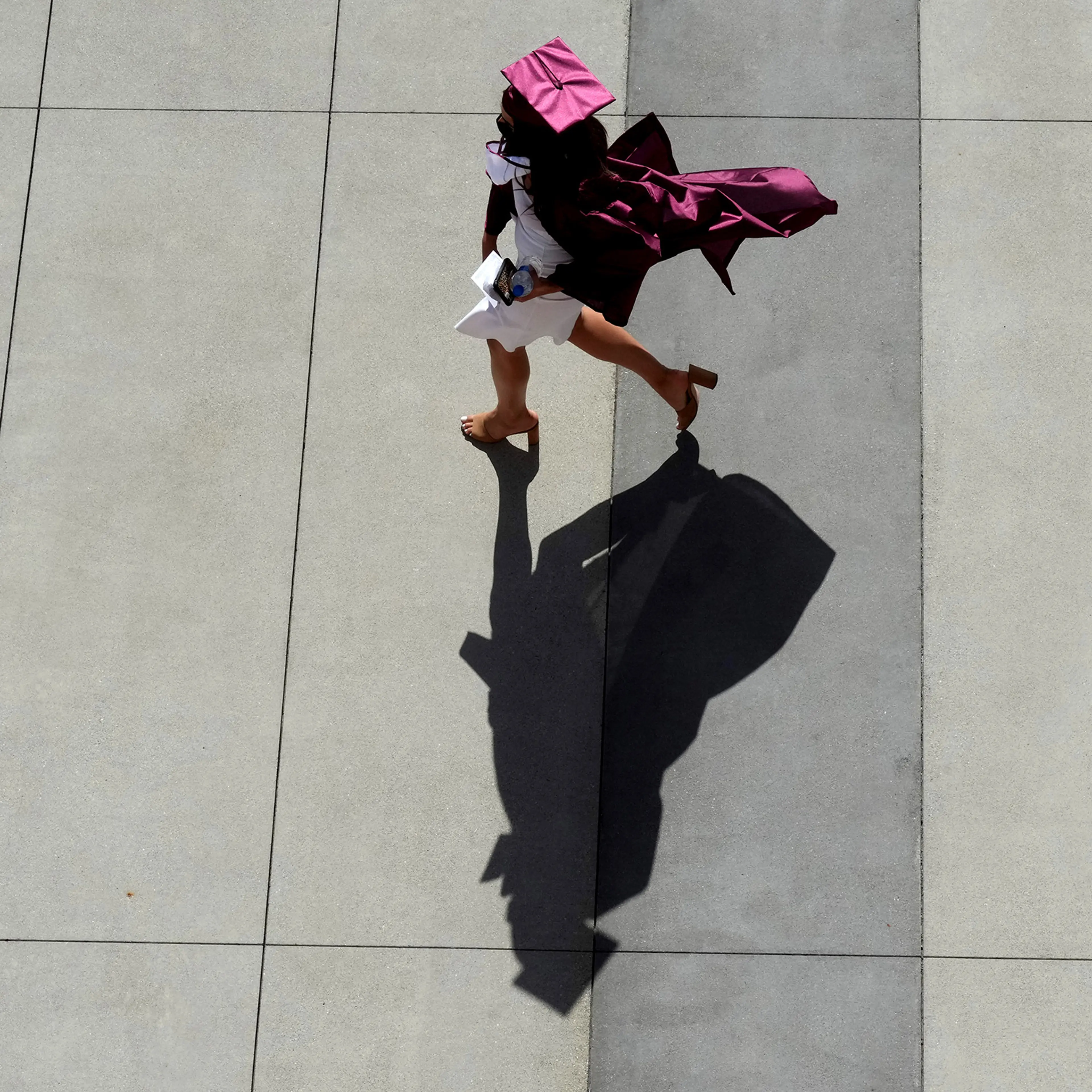 A graduate makes their way to the staging area during the 2021 Mt. Sac graduation in Walnut, Calif. on June 11, 2021.