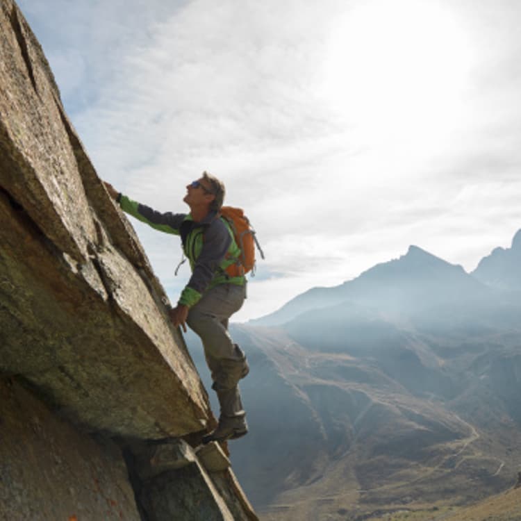 man-climbing-mountain