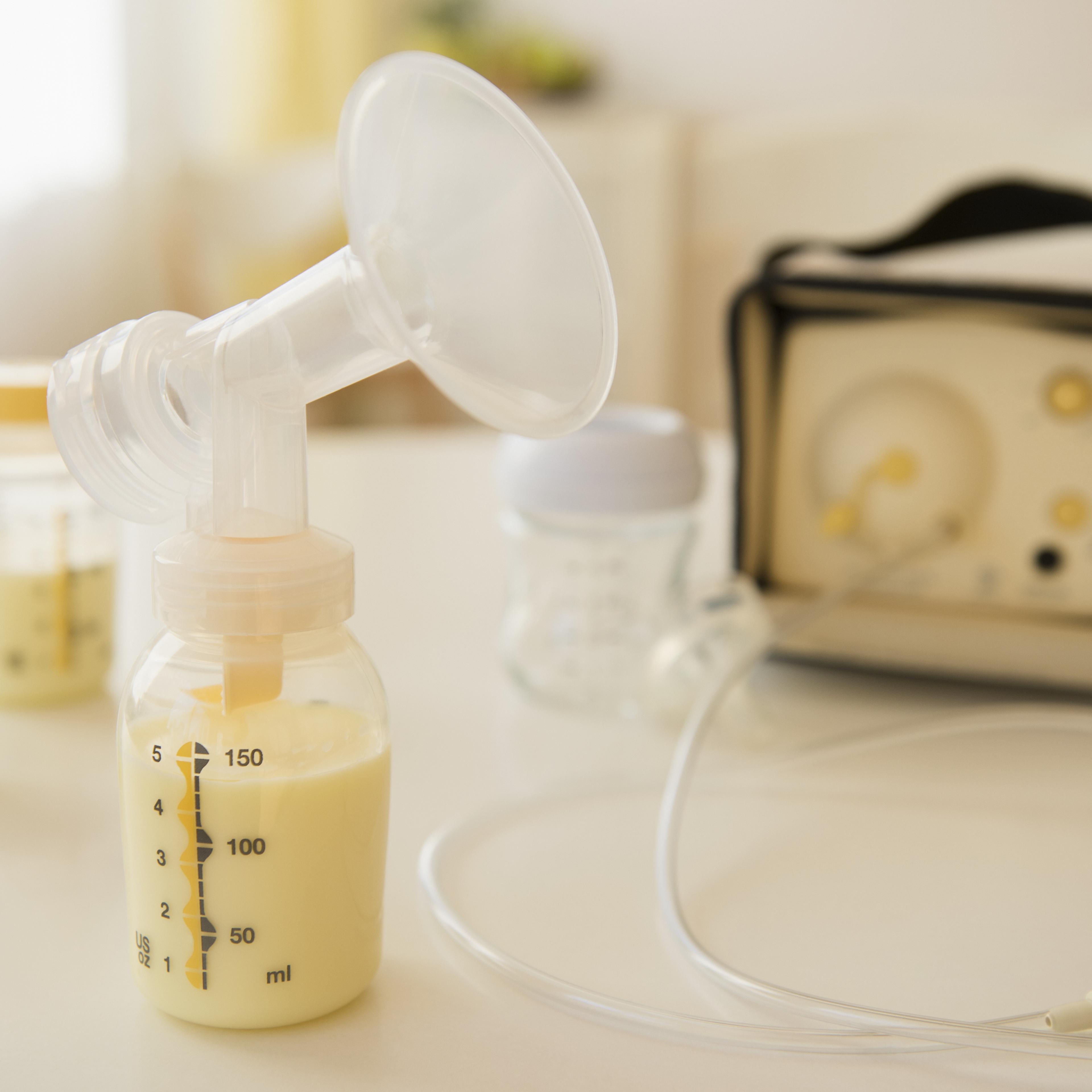 Breast pump with bottles