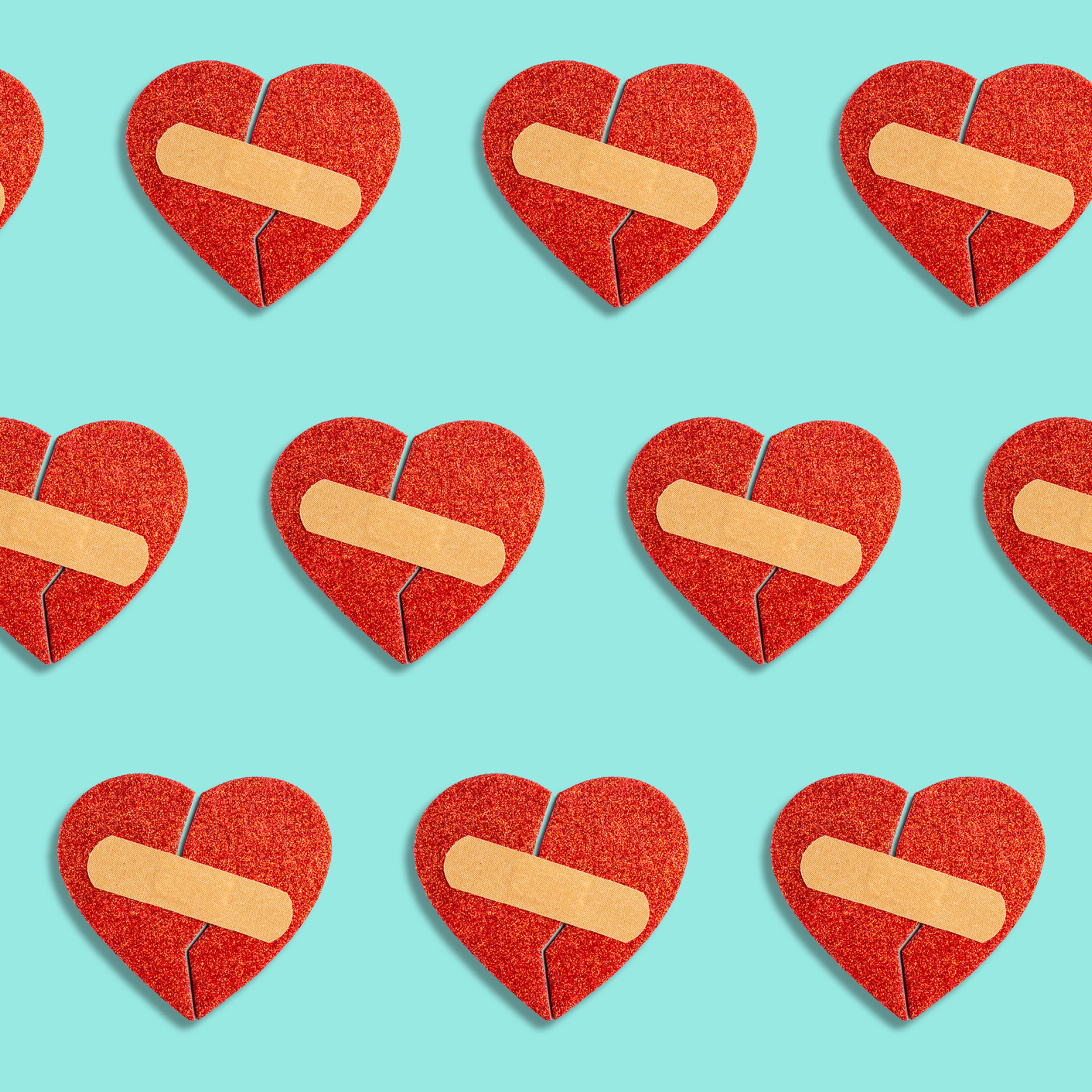 Broken red heart with medical patch on blue background. Abstract pattern love concept