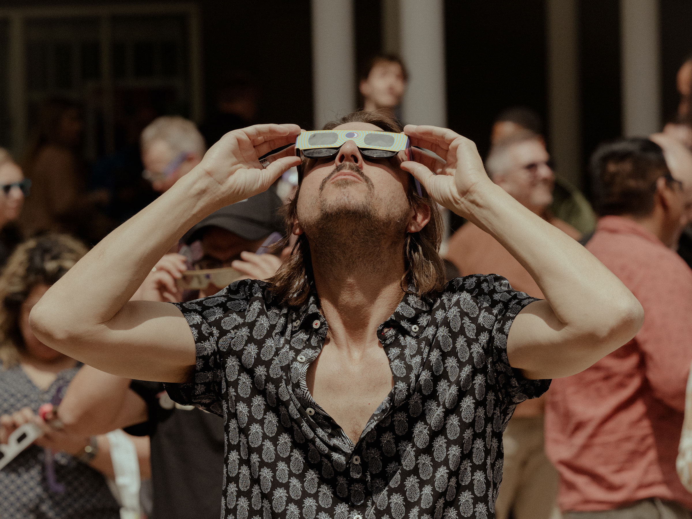 Solar eclipse viewing at Main Street Garden Park in Dallas, Texas.