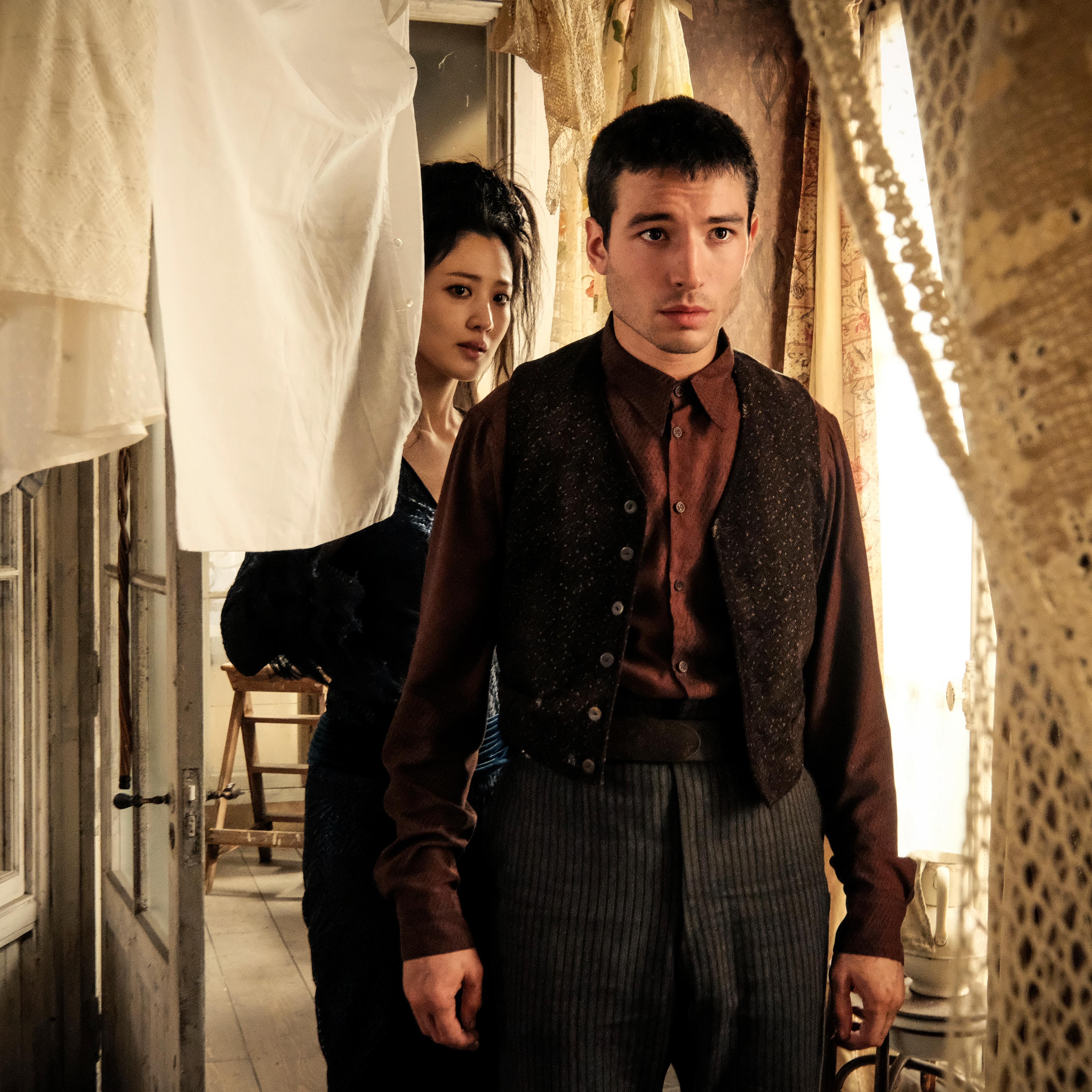 Claudia Kim and Ezra Miller in <i>Fantastic Beasts: The Crimes of Grindelwald</i>