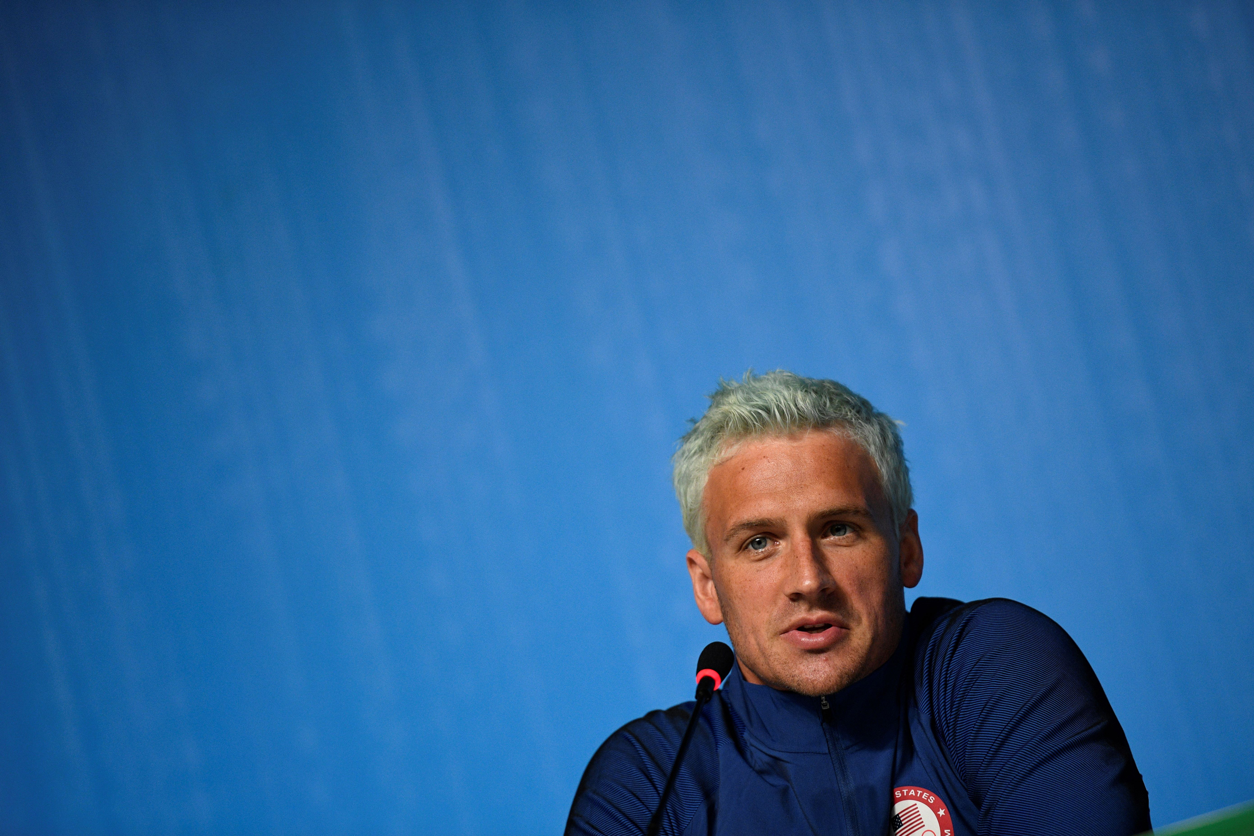 US swimmer Ryan Lochte holds a press conference on August 3, 2016 in Rio de Janeiro, two days ahead of the opening ceremony of the Rio 2016 Olympic Games. / AFP / MARTIN BUREAU (Photo credit should read MARTIN BUREAU/AFP/Getty Images)