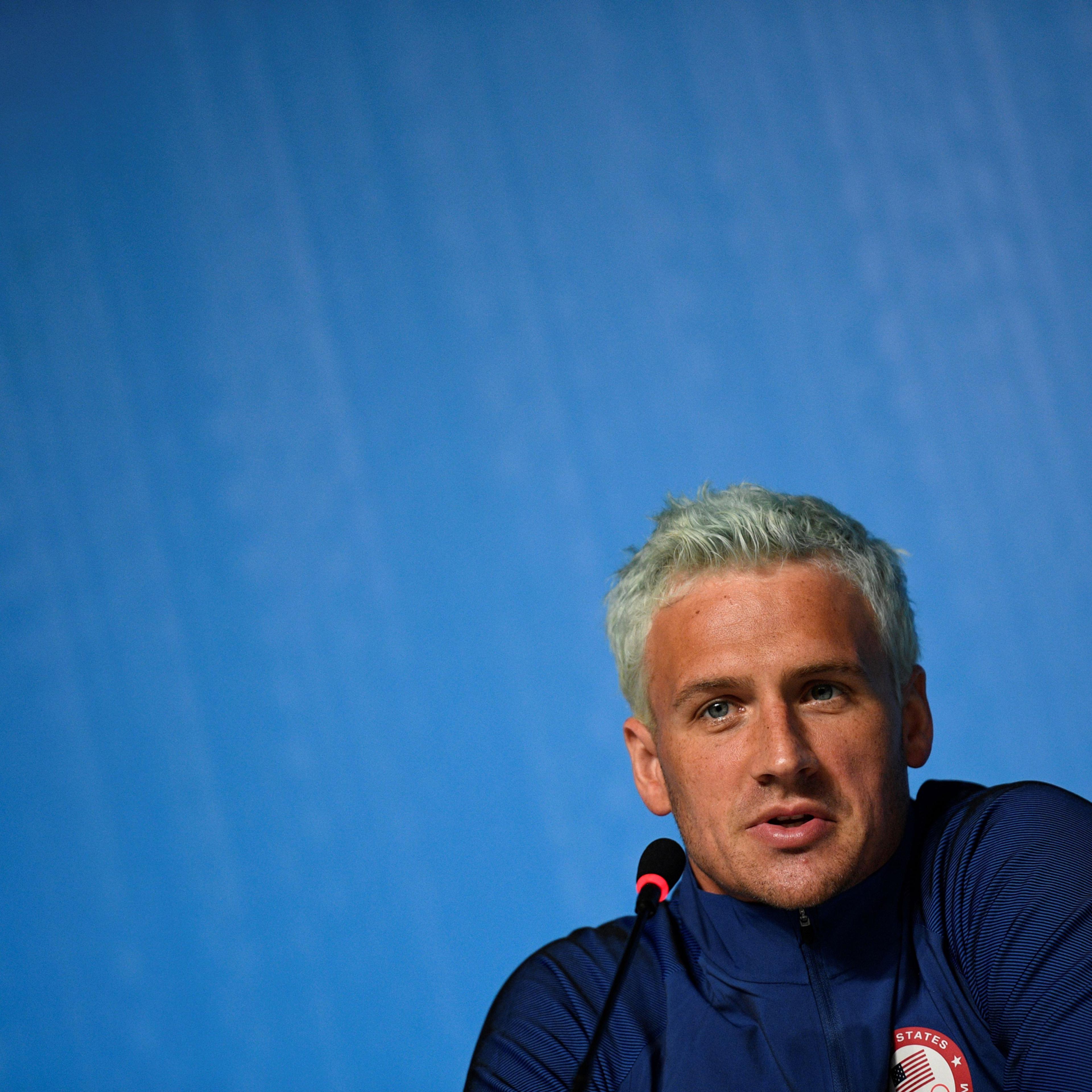 US swimmer Ryan Lochte holds a press conference on August 3, 2016 in Rio de Janeiro, two days ahead of the opening ceremony of the Rio 2016 Olympic Games. / AFP / MARTIN BUREAU (Photo credit should read MARTIN BUREAU/AFP/Getty Images)