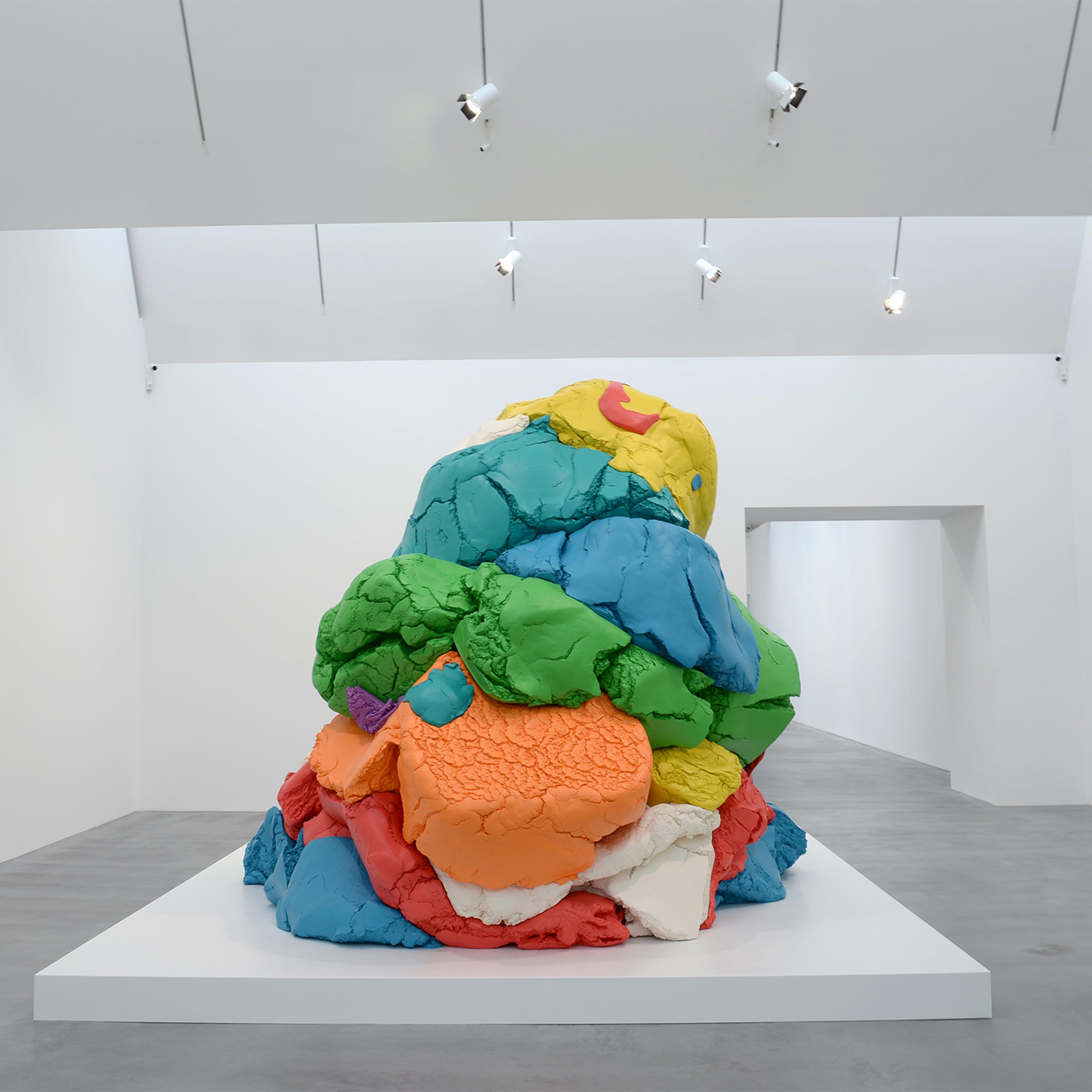 A man views Jeff Koons' sculpture "Play-Doh 1994-2014" during the opening of the Newport Street Gallery's new exhibition, "Jeff Koons: Now" in London, UK on May 17, 2016.
