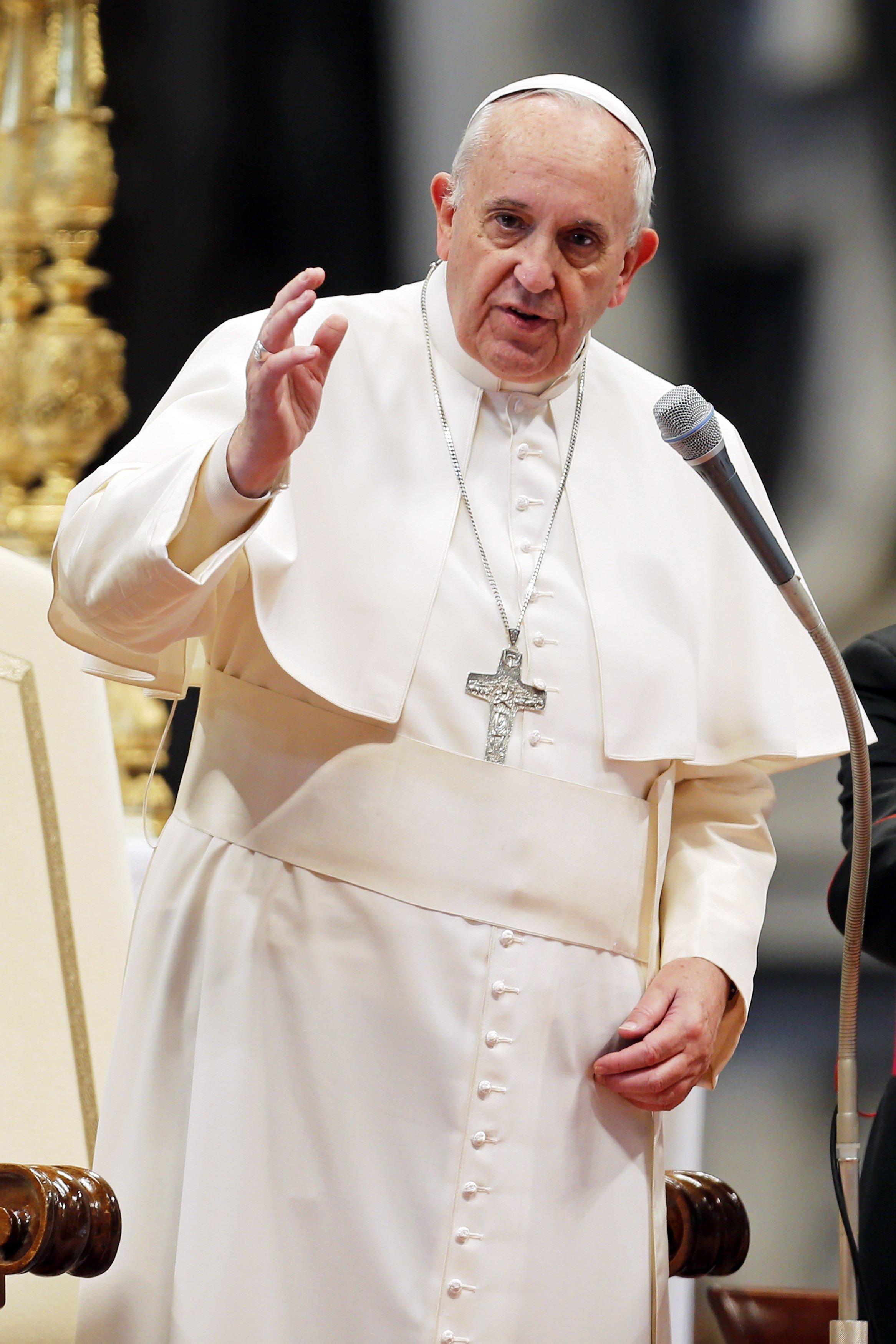 Pope Francis delivers his blessing at the end of an audience with Italian athletes in St. Peter's Basilica at the Vatican