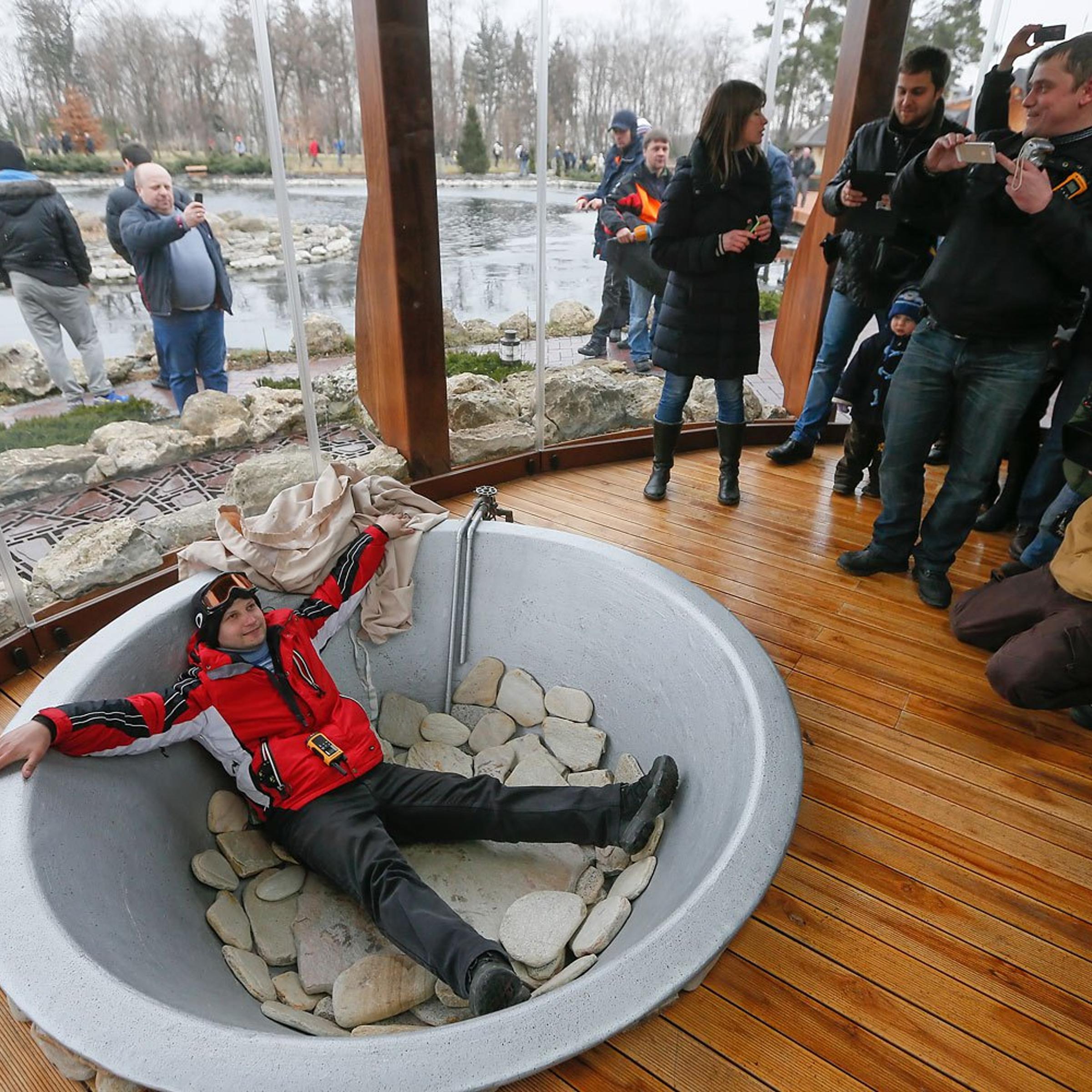 A protester poses in a bathtub at President Viktor Yanukovych's Mezhyhirya estate, which was abandoned by security, on Feb. 22, 2014 in Kiev, Ukraine.