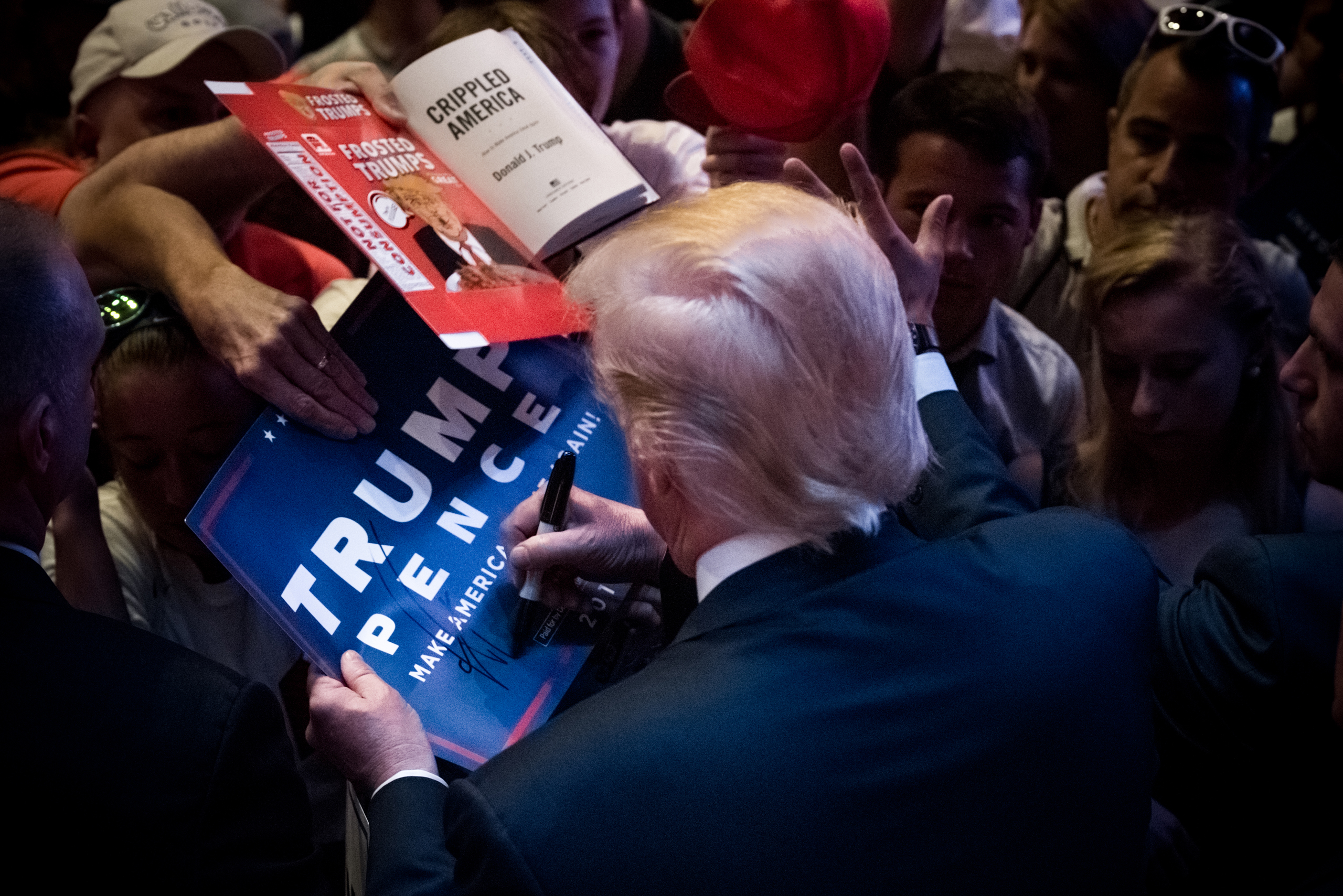 GOP Presidential nominee, Donald J. Trump, signs memorabilia while campaigning in Portland, Maine, on Thursday August 4, 2016. The candidate has faced a controversial week in the media but saw a positive response during the rally at City Hall. (Photo by 