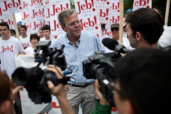 Republican Presidential candidate Jeb Bush speaks to the press at the 4th of July Parade in Merrimack, New Hampshire.