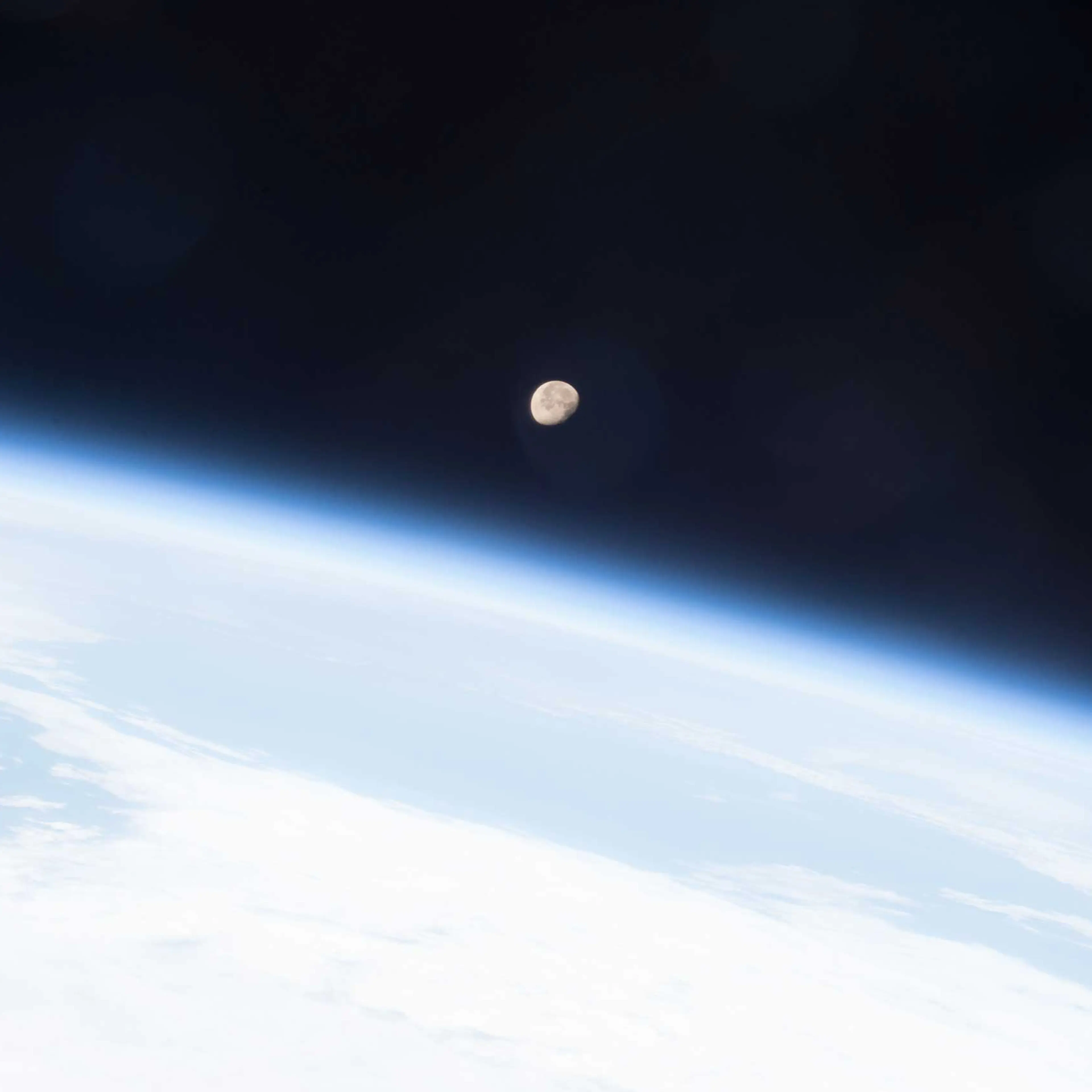The Moon shines brightly on planet Earth's horizon in this image snapped from the International Space Station May 7, 2015 by the crew of Expedition 43 led by Commander Terry Virts, NASA astronaut.