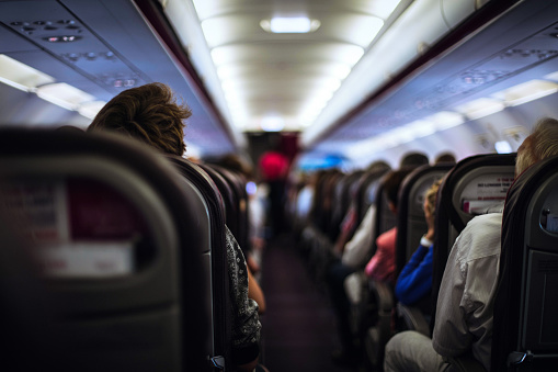 Passengers seated in airplane