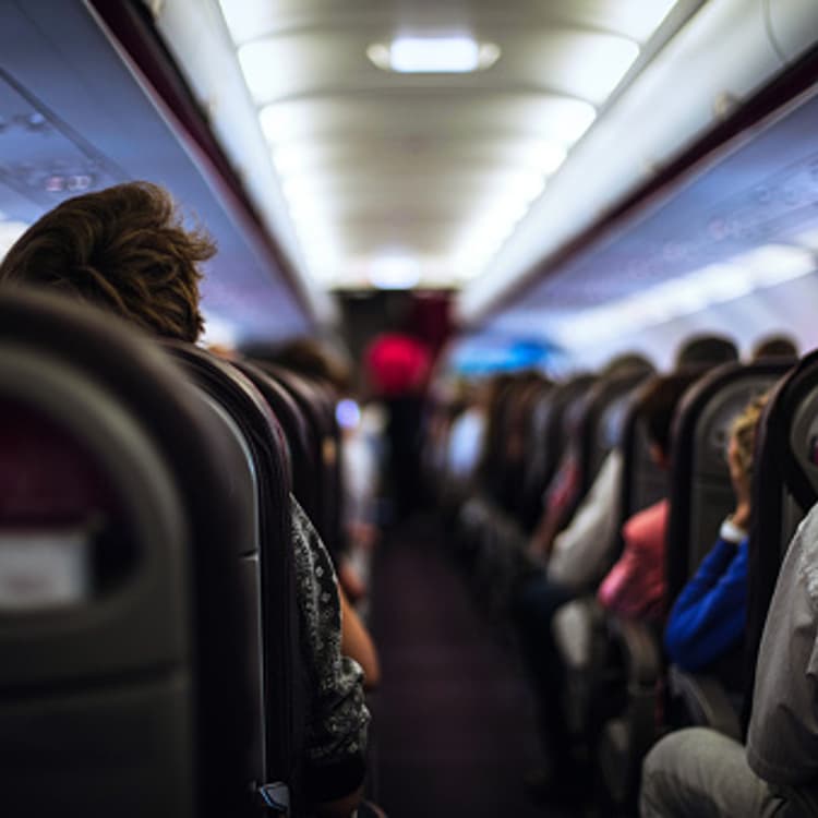 Passengers seated in airplane