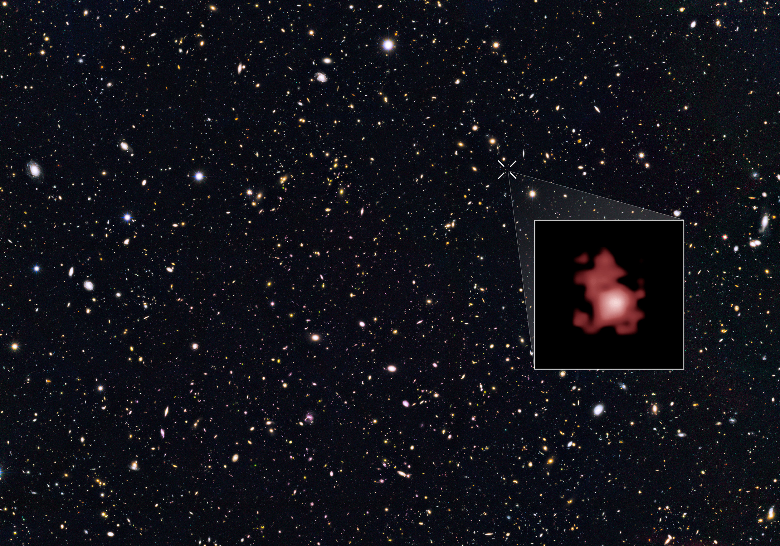This image shows the position of the most distant galaxy discovered so far within a deep sky Hubble Space Telescope survey called GOODS North (Great Observatories Origins Deep Survey North). The remote galaxy GN-z11, shown in the inset, existed only 400 