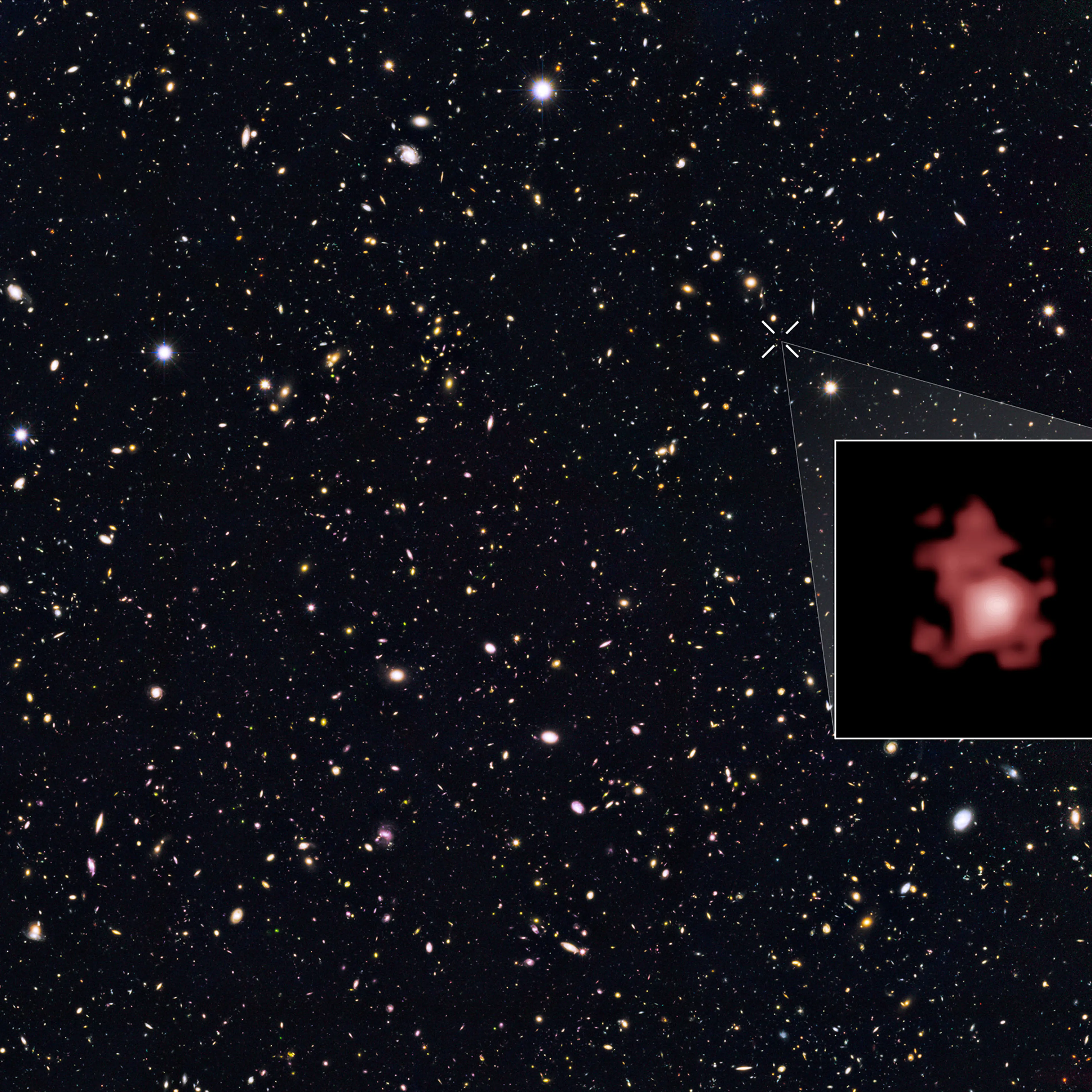 This image shows the position of the most distant galaxy discovered so far within a deep sky Hubble Space Telescope survey called GOODS North (Great Observatories Origins Deep Survey North). The remote galaxy GN-z11, shown in the inset, existed only 400
