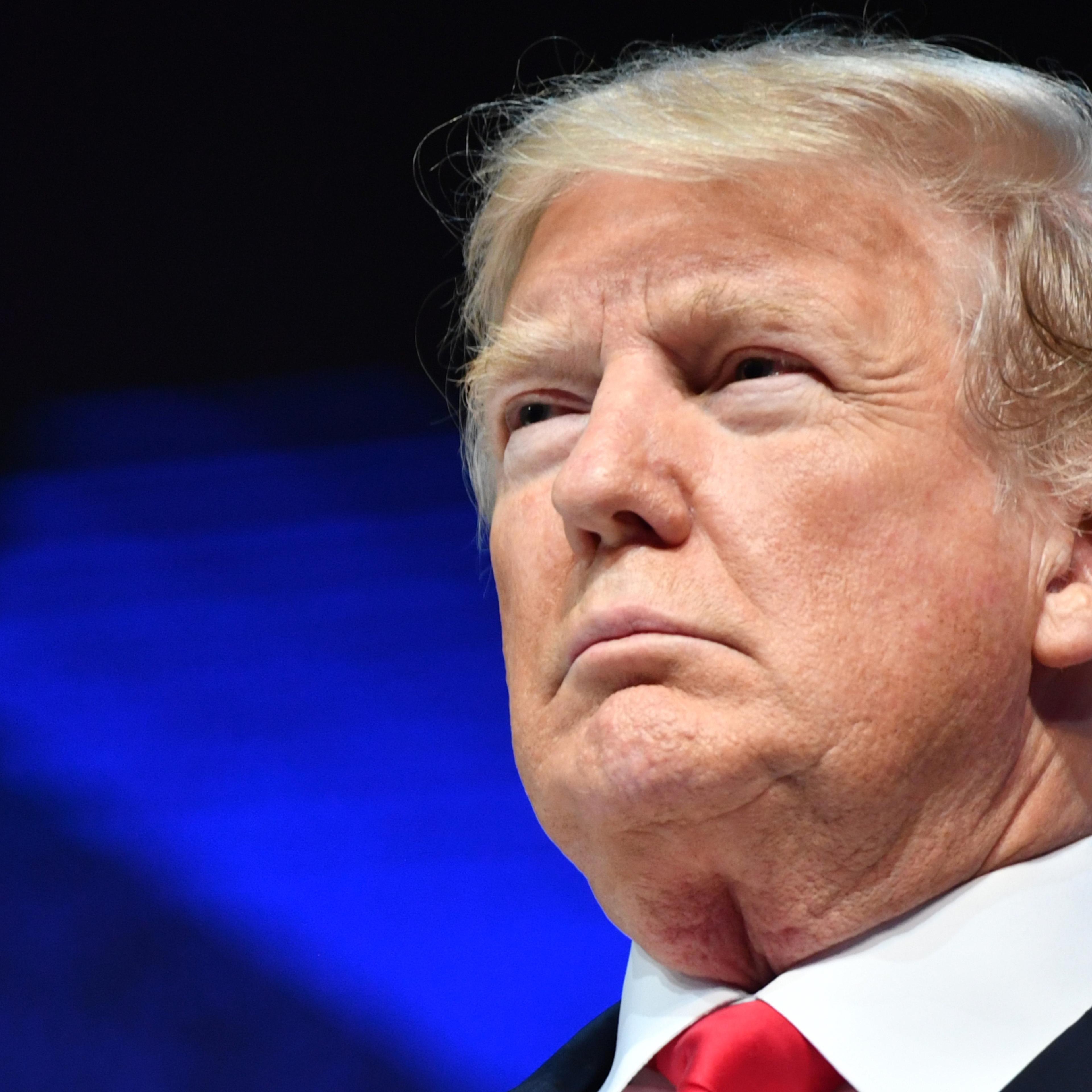 Donald Trump looks on at Davos