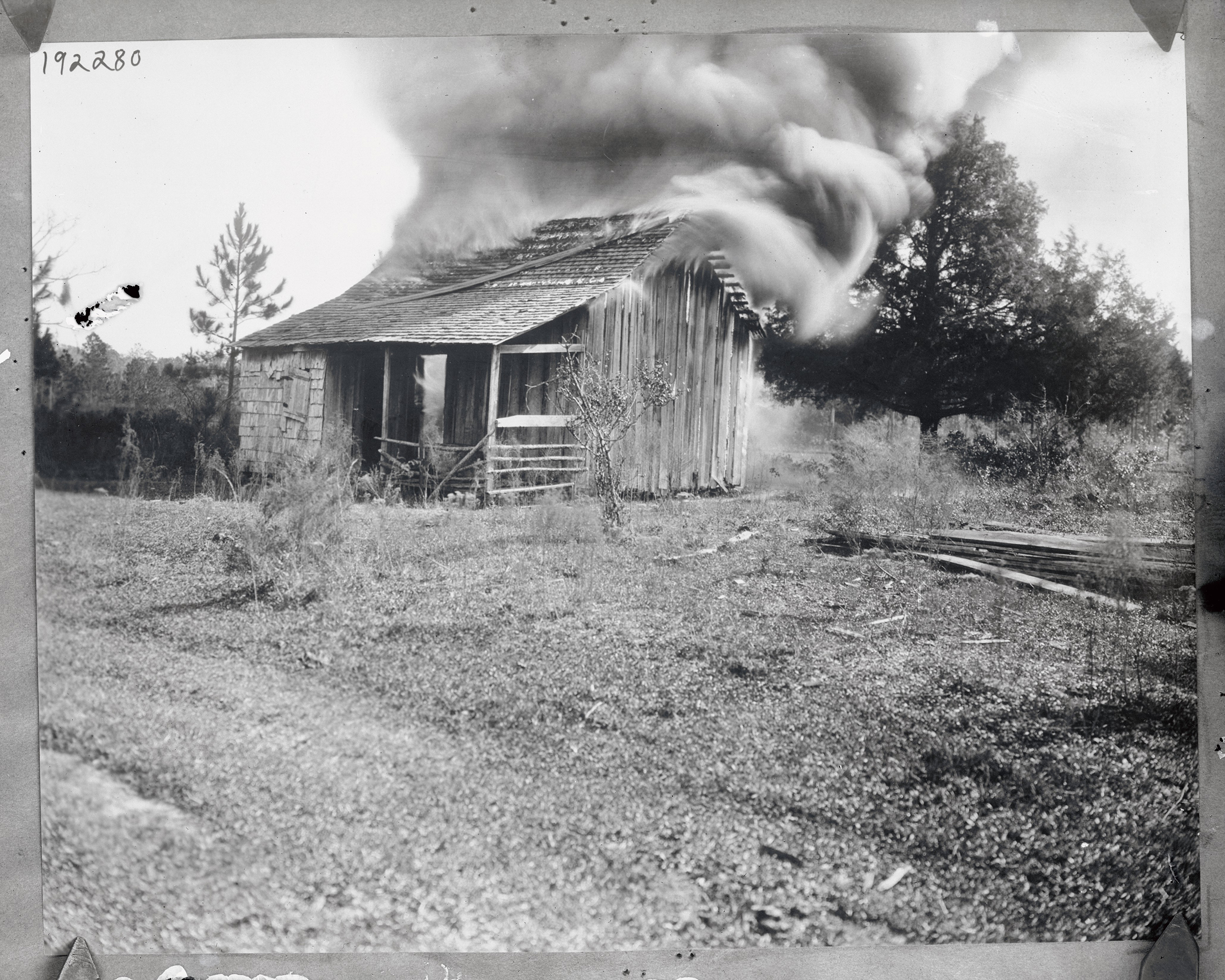 A home burns on Jan. 9, 1923, during a white mob’s attacks on the Black community of Rosewood, Fla.