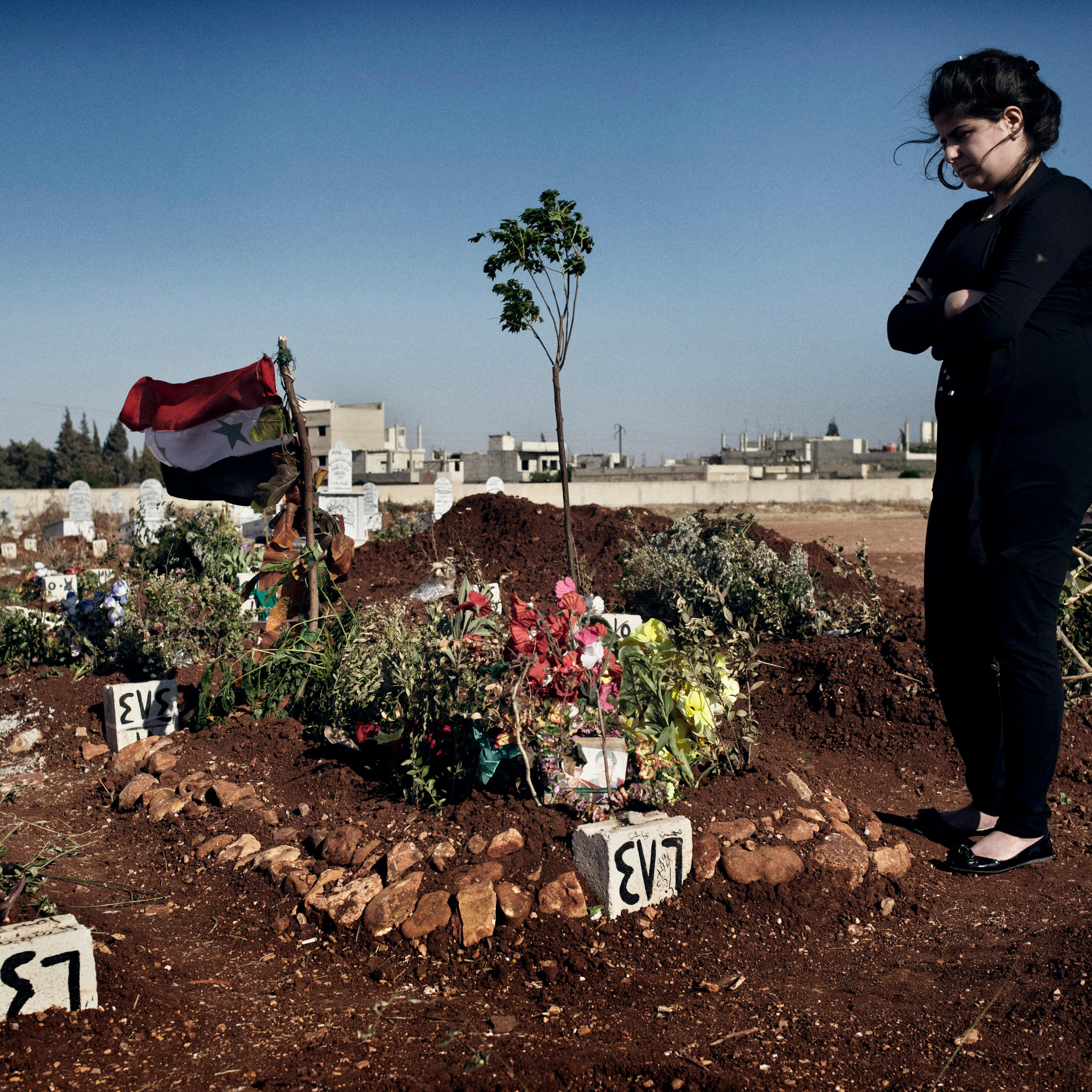 Rashan, 17, buried her husband of five months in the Martyrs of Firdous Cemetery, Zahara neighborhood, Homs.