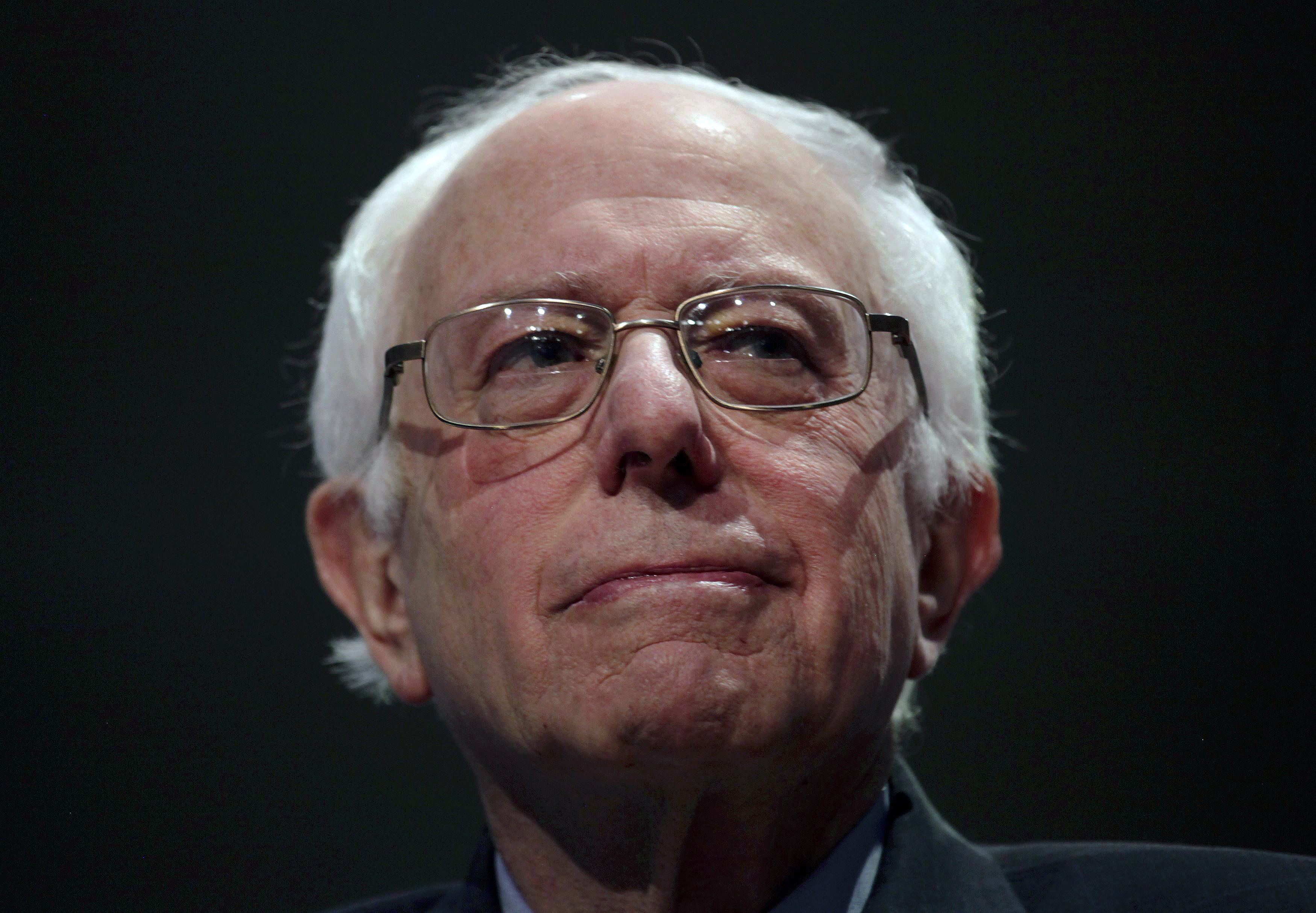 Democratic. presidential candidate, Vermont Senator Bernie Sanders appears with former Secretary of State Hillary Clinton at a debate in Milwaukee on Feb. 11, 2016.