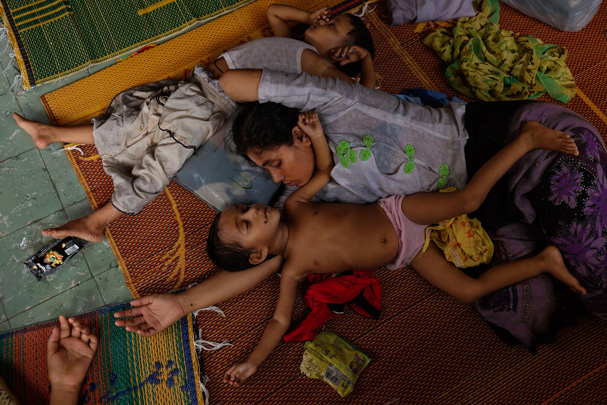 Children rest at a refugee camp in Bayeun, outside of Langsa, Indonesia, May 20. They were among the 25,000-plus Rohingya Muslim migrants who have fled reported persecution in Burma and Bangladesh this year by crossing the Indian Ocean in search of refugee status in Indonesia and Malaysia. 