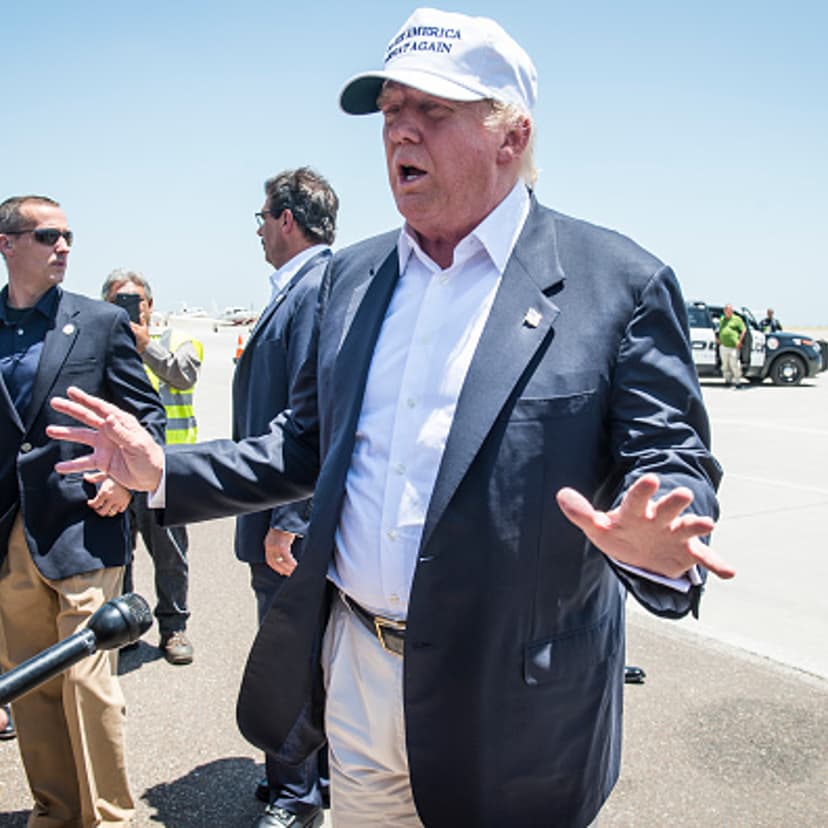 Republican Presidential candidate and business mogul Donald Trump talks to the media after exiting his plane during his trip to the border on July 23, 2015 in Laredo, Texas.