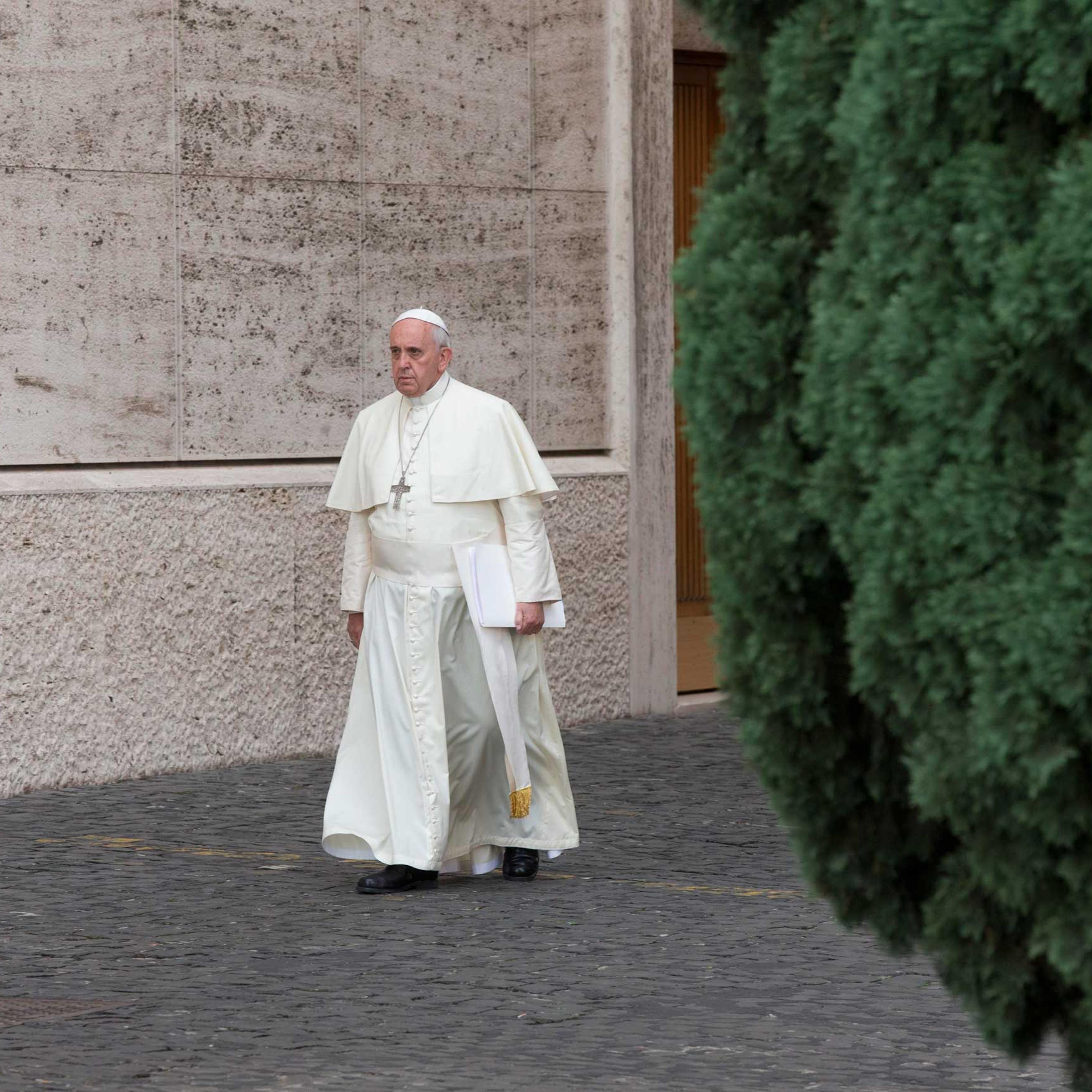 Pope Francis arrives at a morning session of a two-week synod on family issues, at the Vatican, Oct. 16, 2014.