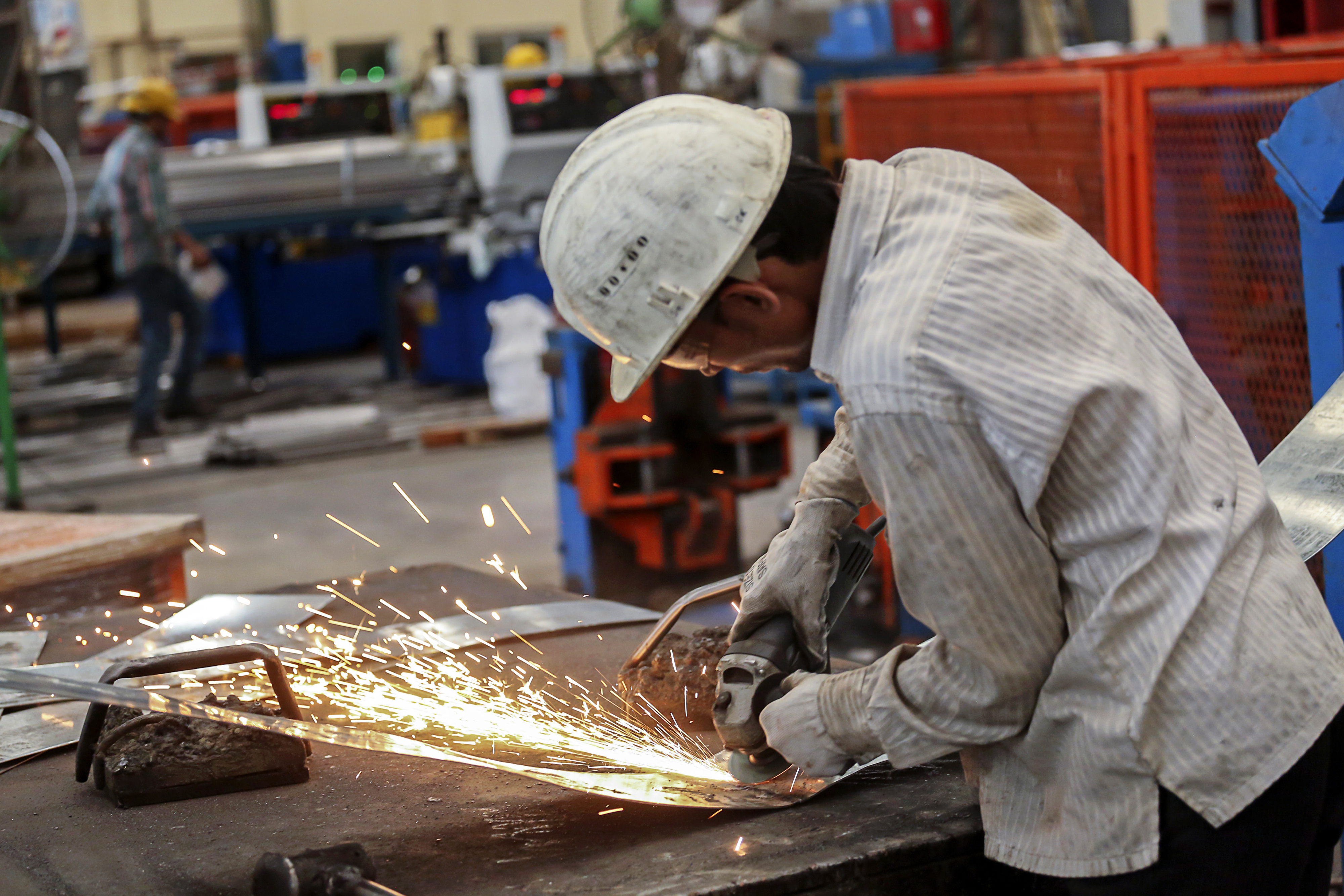A worker at a company processing steel in Khopoli, India, in 2014.
