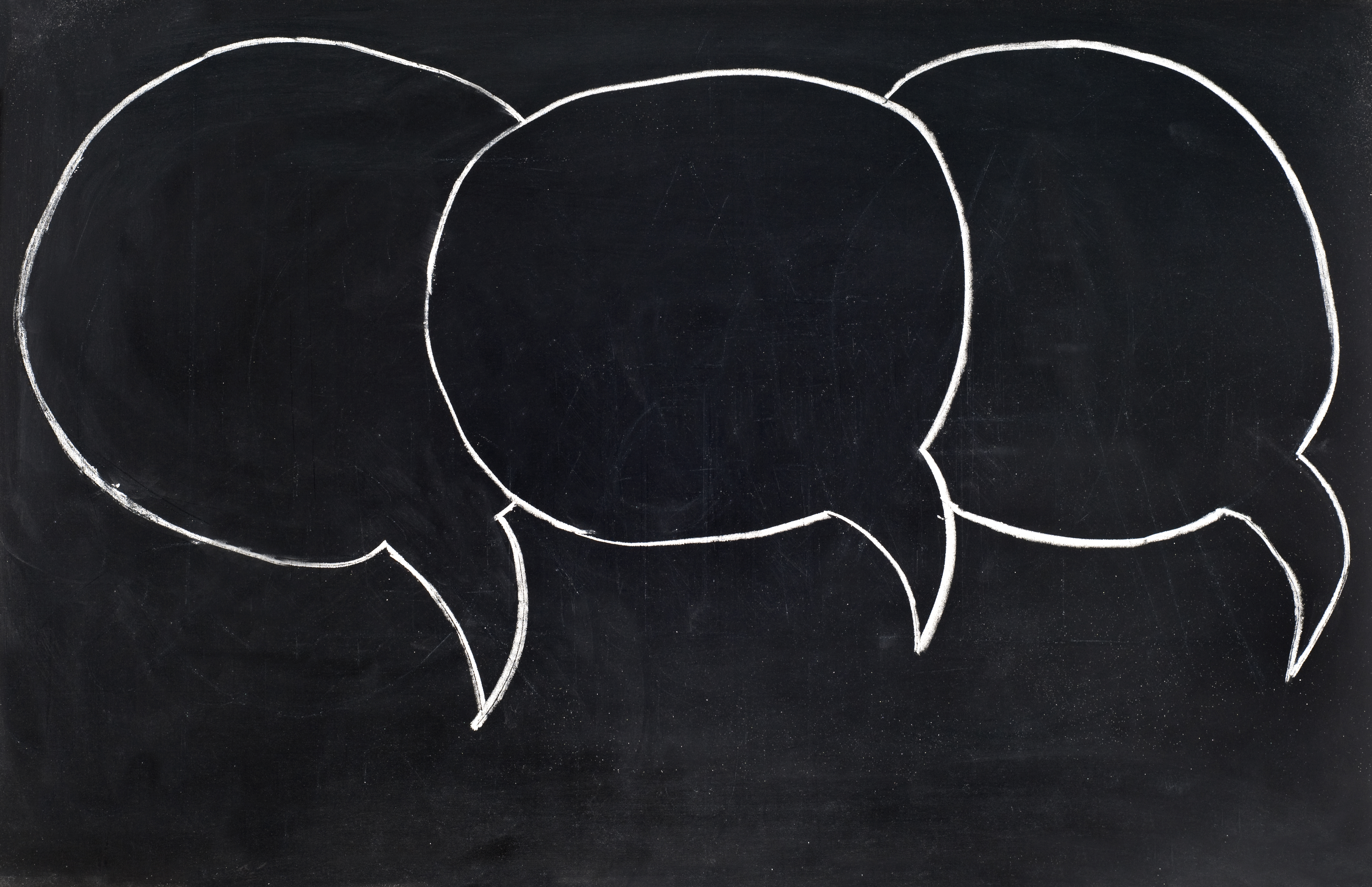 Speech bubbles on blackboard