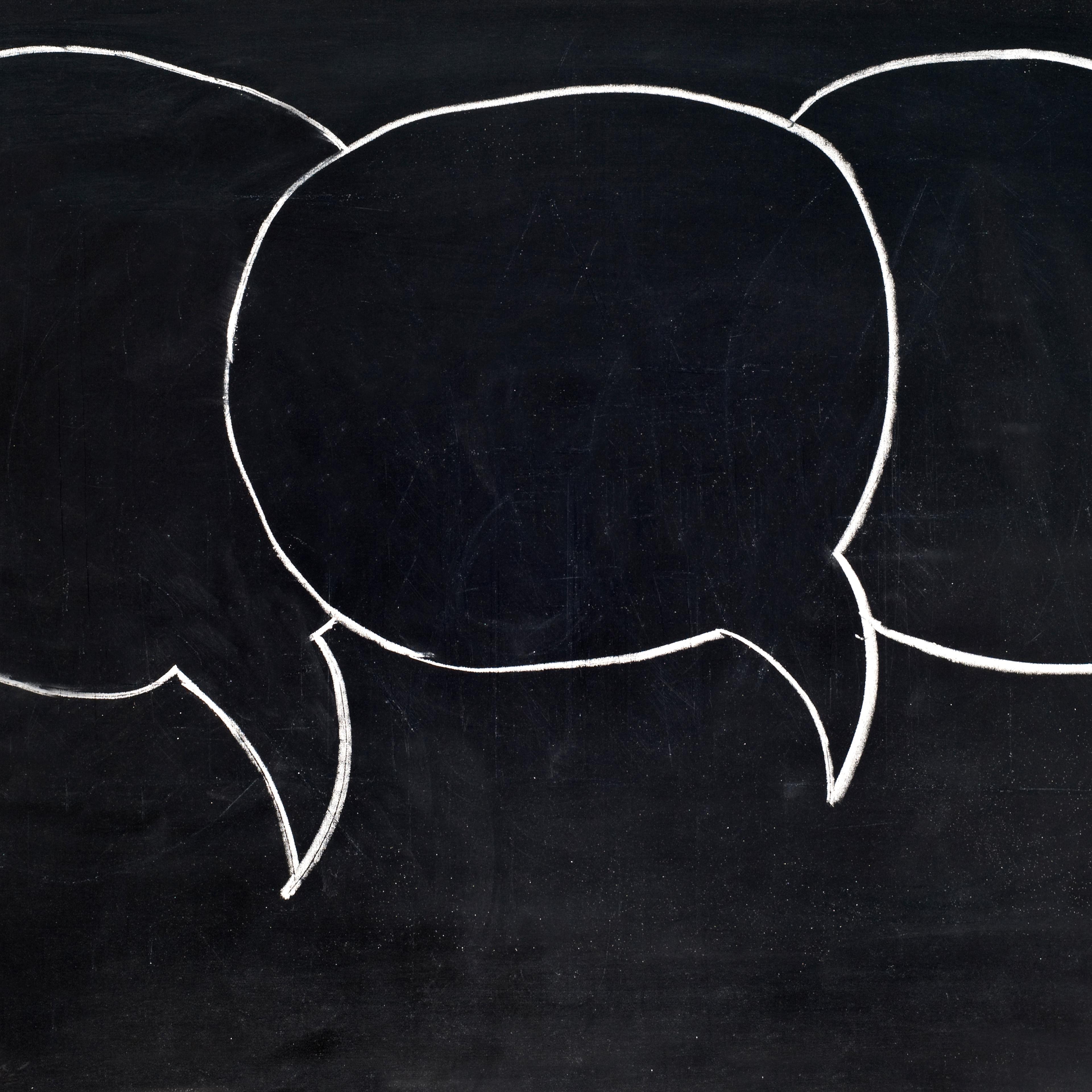 Speech bubbles on blackboard