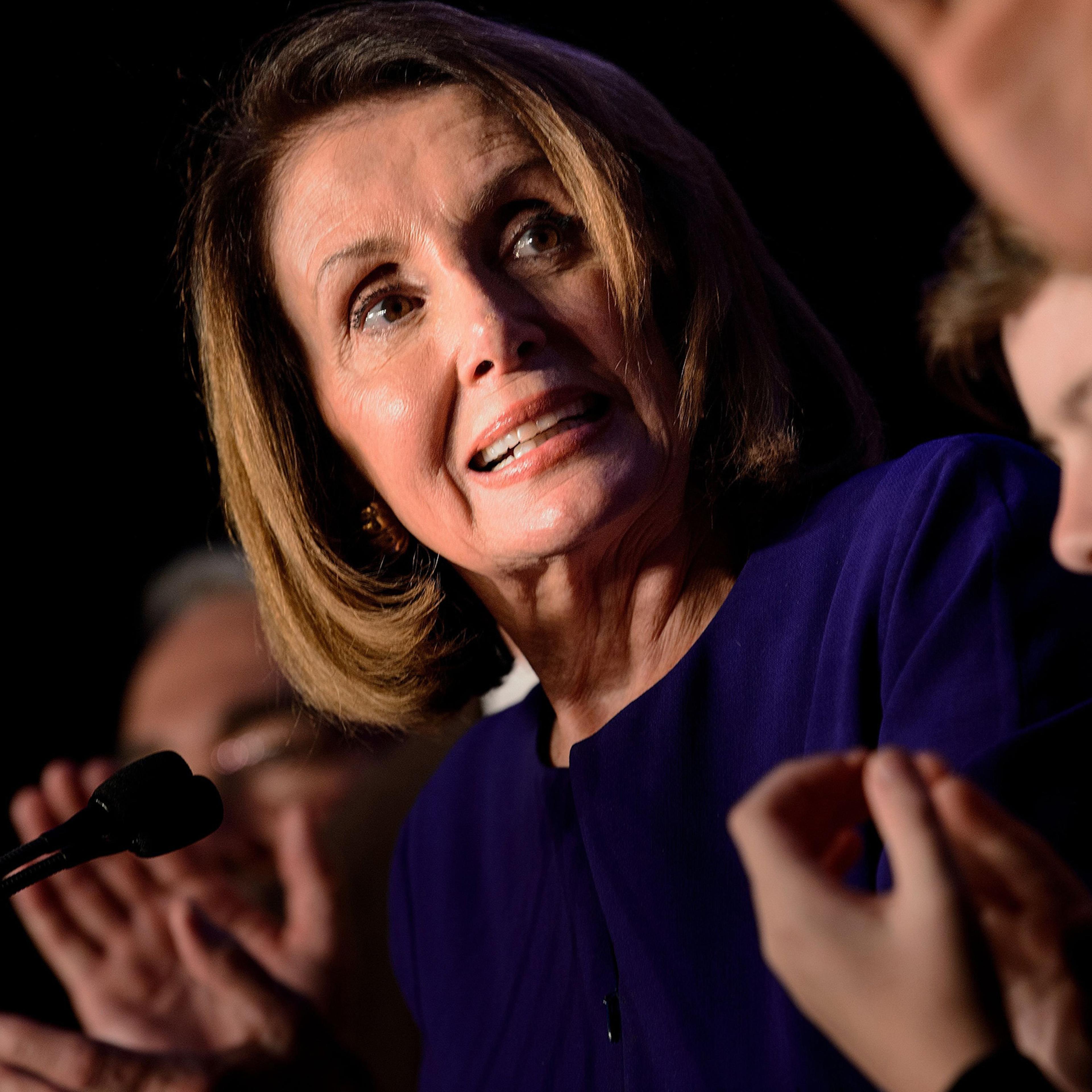 Surrounded by supporters House Minority Leader Nancy Pelosi celebrates a projected Democratic Party takeover of the House of Representatives during a midterm election night party hosted by the Democratic Congressional Campaign Committee in Washington, DC on on Nov. 6, 2018.