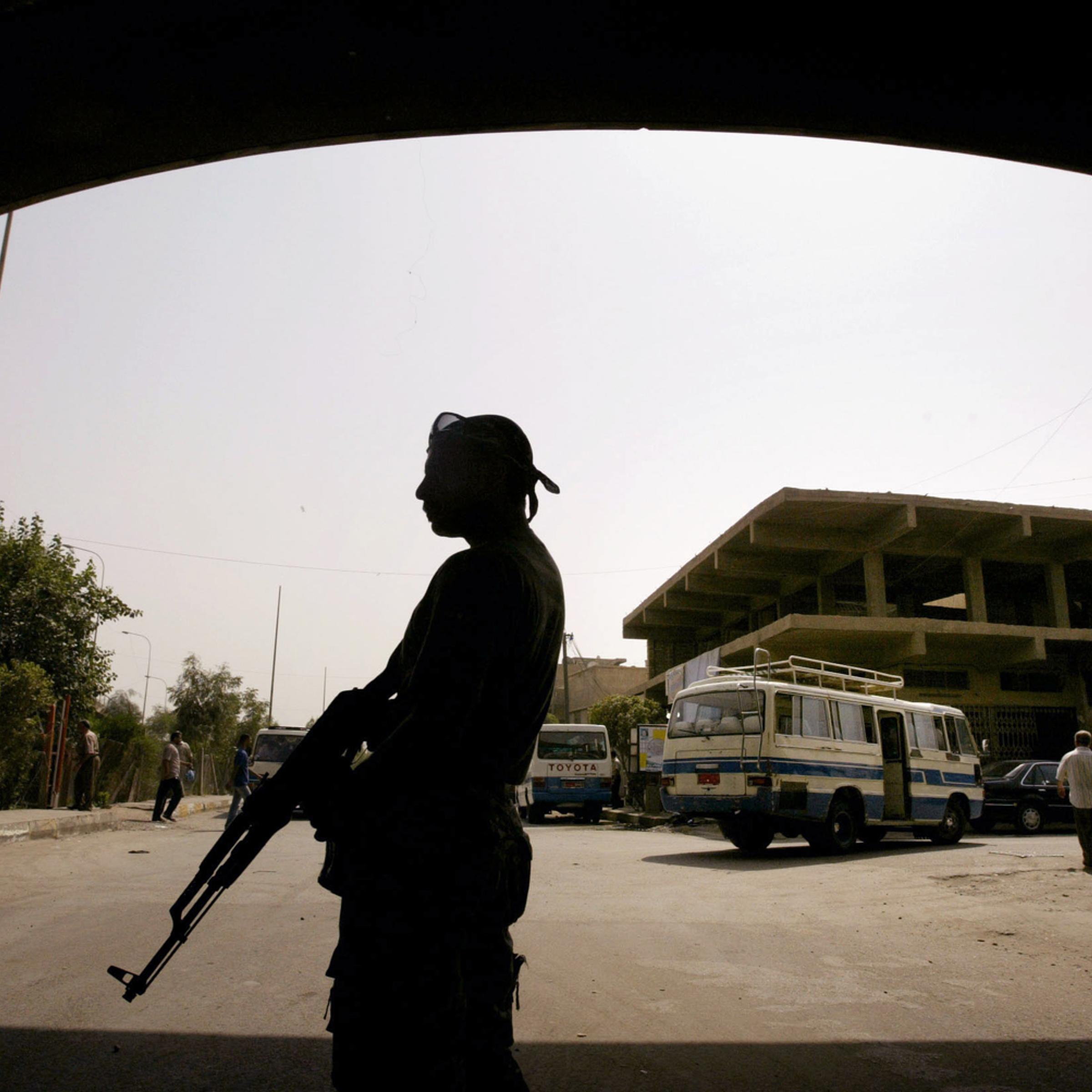 A member of the U.S.-backed Neighborhood Patrol Awakening Council stands guard in the Sunni Adhamiya district north of Baghdad in 2008.