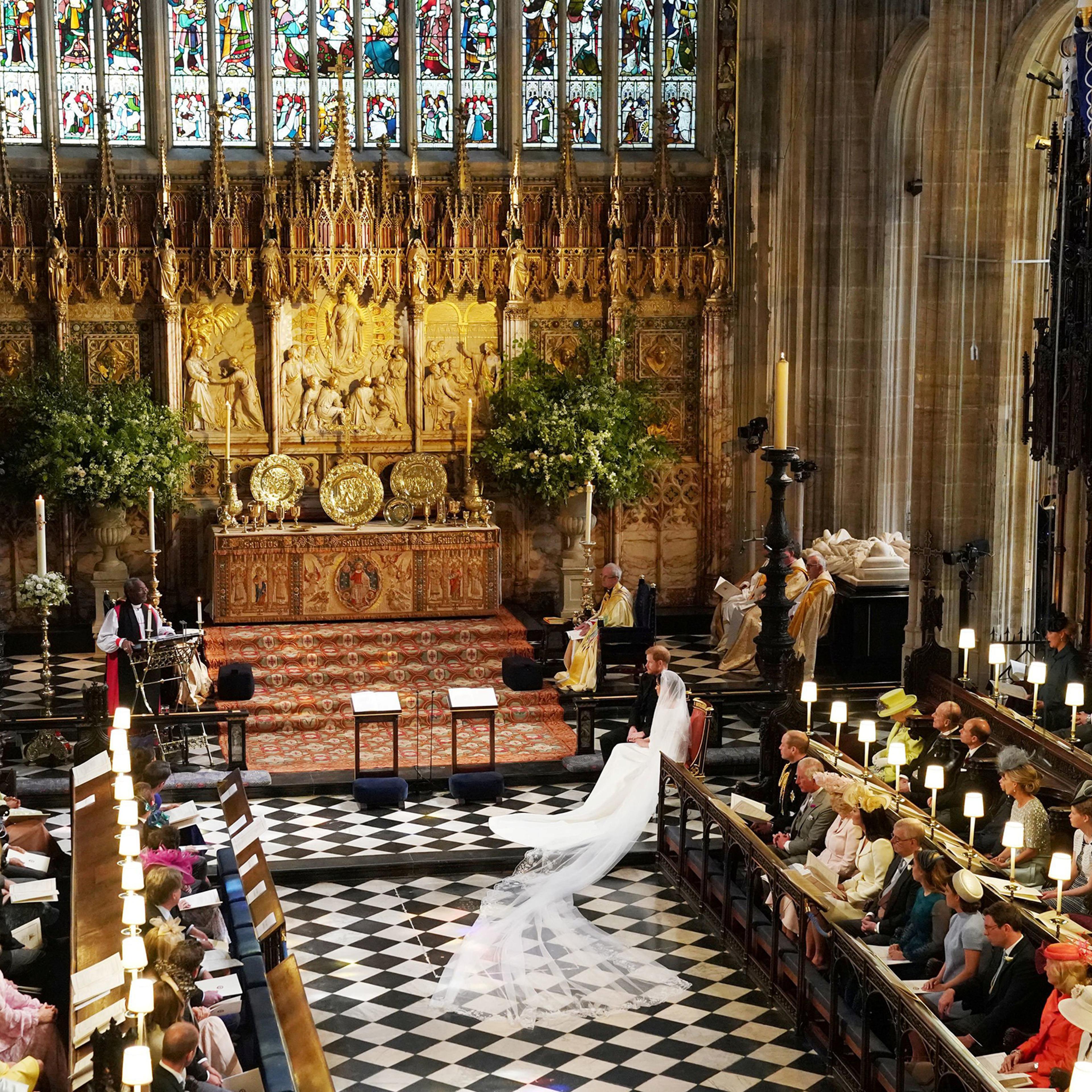 Prince Harry and Meghan Markle listen to an address by the Most Rev. Bishop Michael Curry, presiding bishop of the American Episcopal Church, in St George's Chapel at Windsor Castle, May 19, 2018.