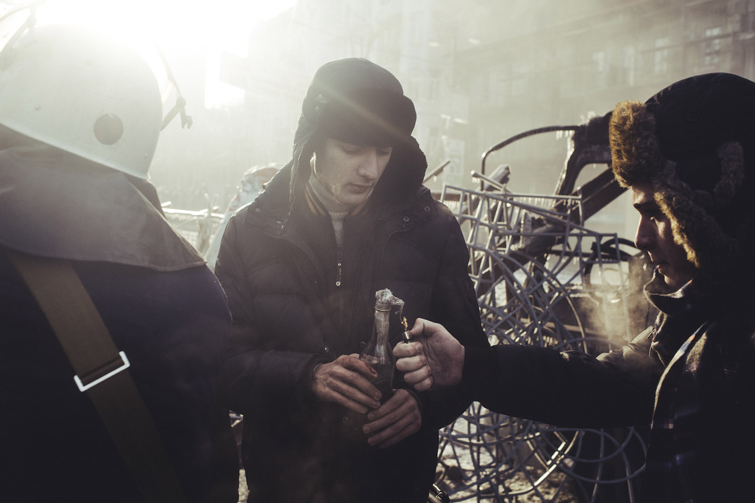 Jan. 20, 2014. A protester sets fire to a Molotov cocktail during clashes with police in central Kiev, Ukraine. 
